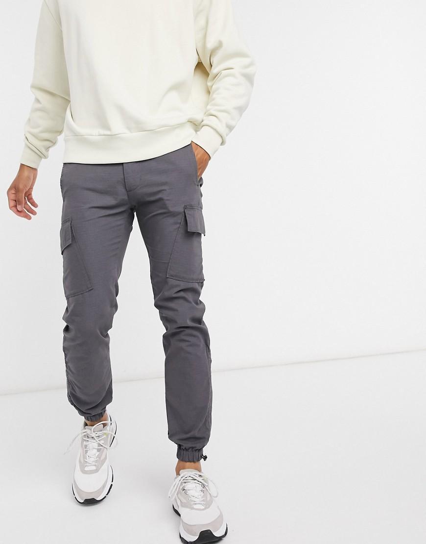 ASOS DESIGN slim cargo pants with toggle hem Product Image