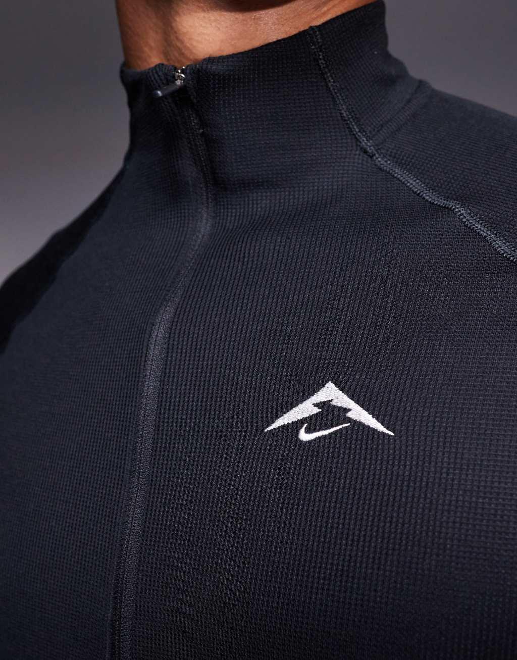 Nike Running Trail logo half zip sweatshirt in black Product Image