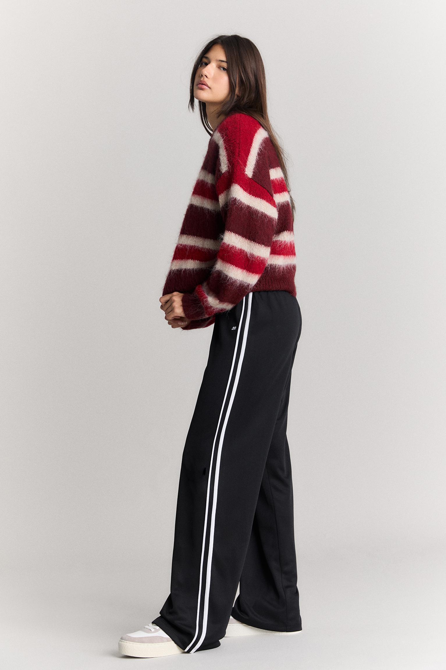 Tracksuit pants with side stripes Product Image