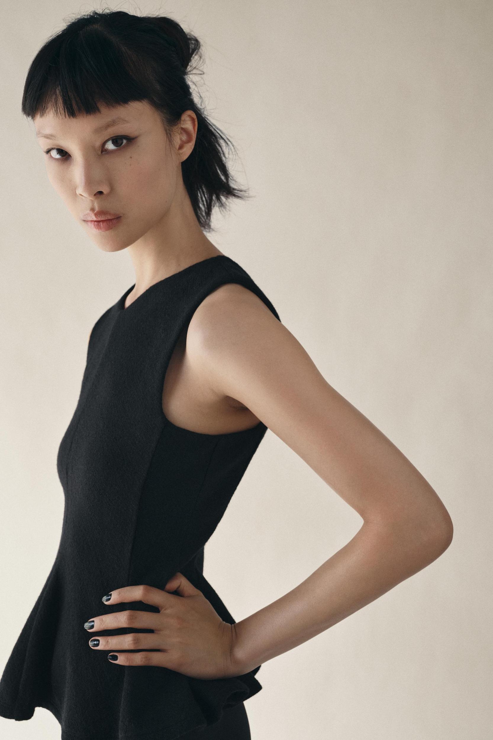 TEXTURED PEPLUM TOP Product Image