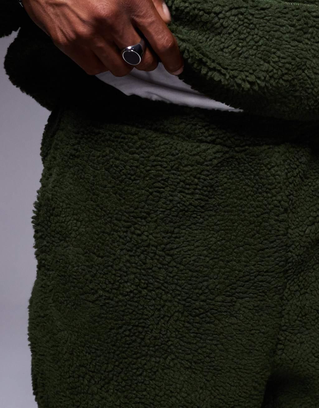 ASOS DESIGN oversized borg sweatpants in green Product Image