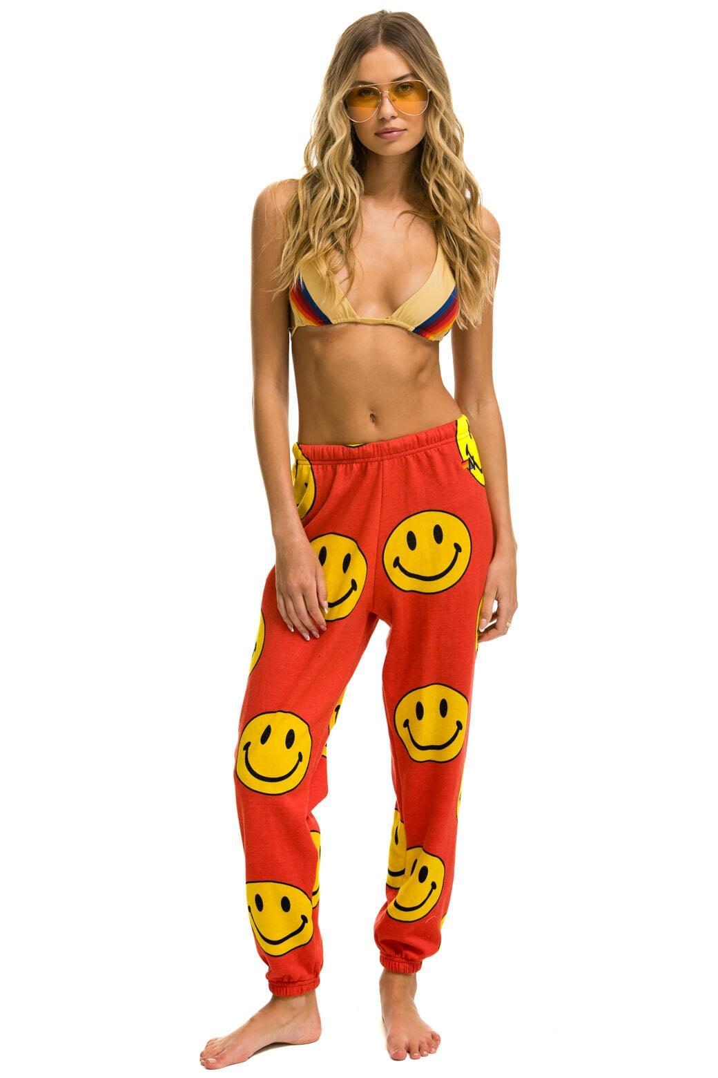 SMILEY REPEAT SWEATPANTS - RED Female Product Image