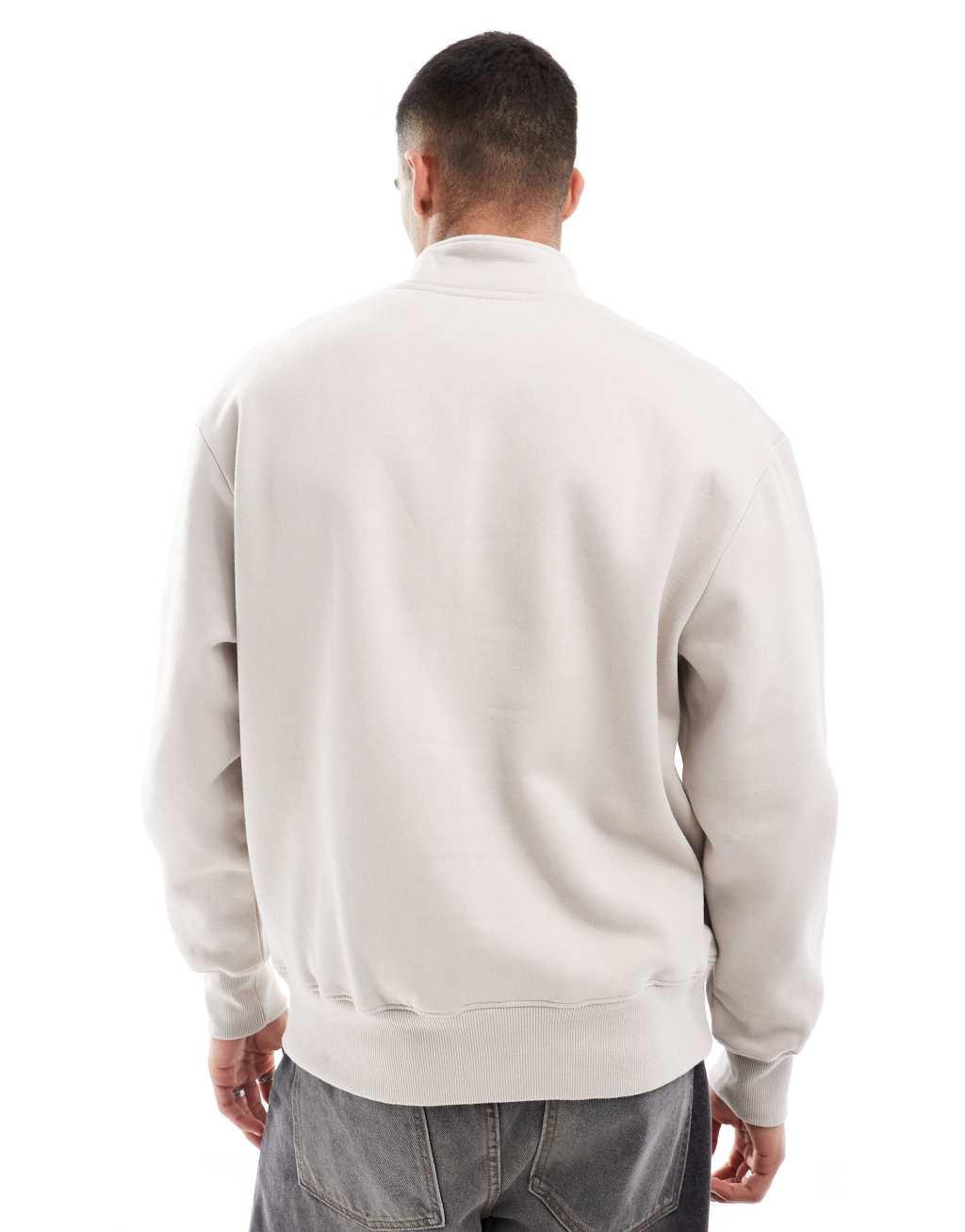 ASOS DESIGN premium heavyweight oversized quarter zip sweatshirt 400gsm in beige Product Image