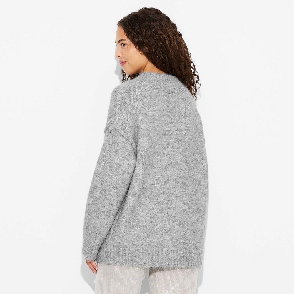 Women's Oversized V-Neck Pullover Holiday Sweater - Wild Fable™ Product Image