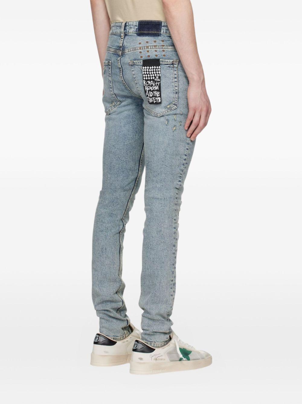 distressed logo-patch jeans Product Image
