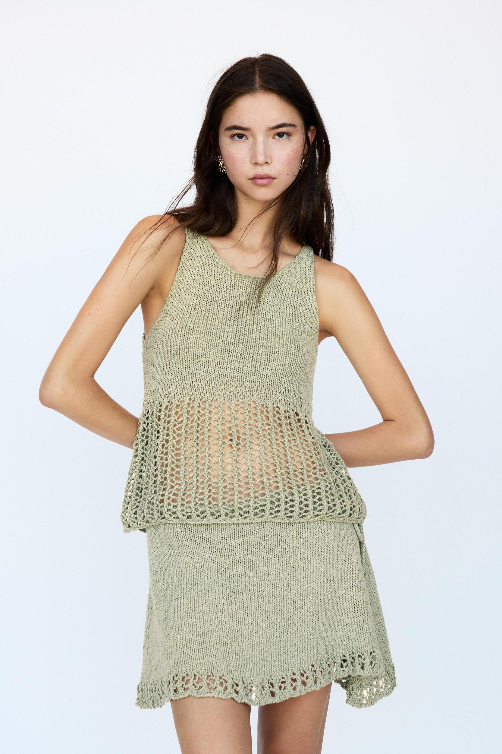 Knit top with an open knit hem Product Image