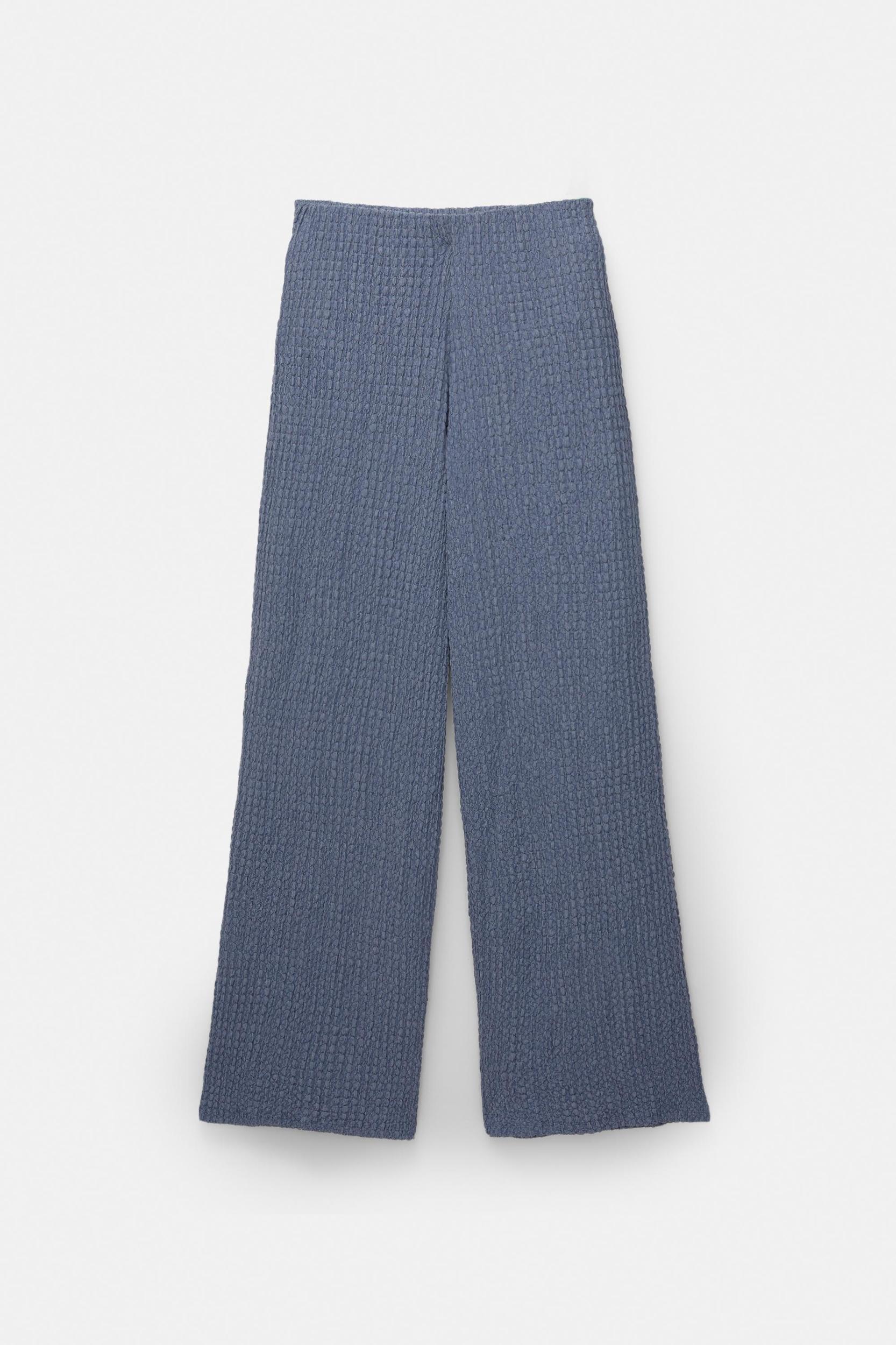 Rustic creased-effect pants Product Image