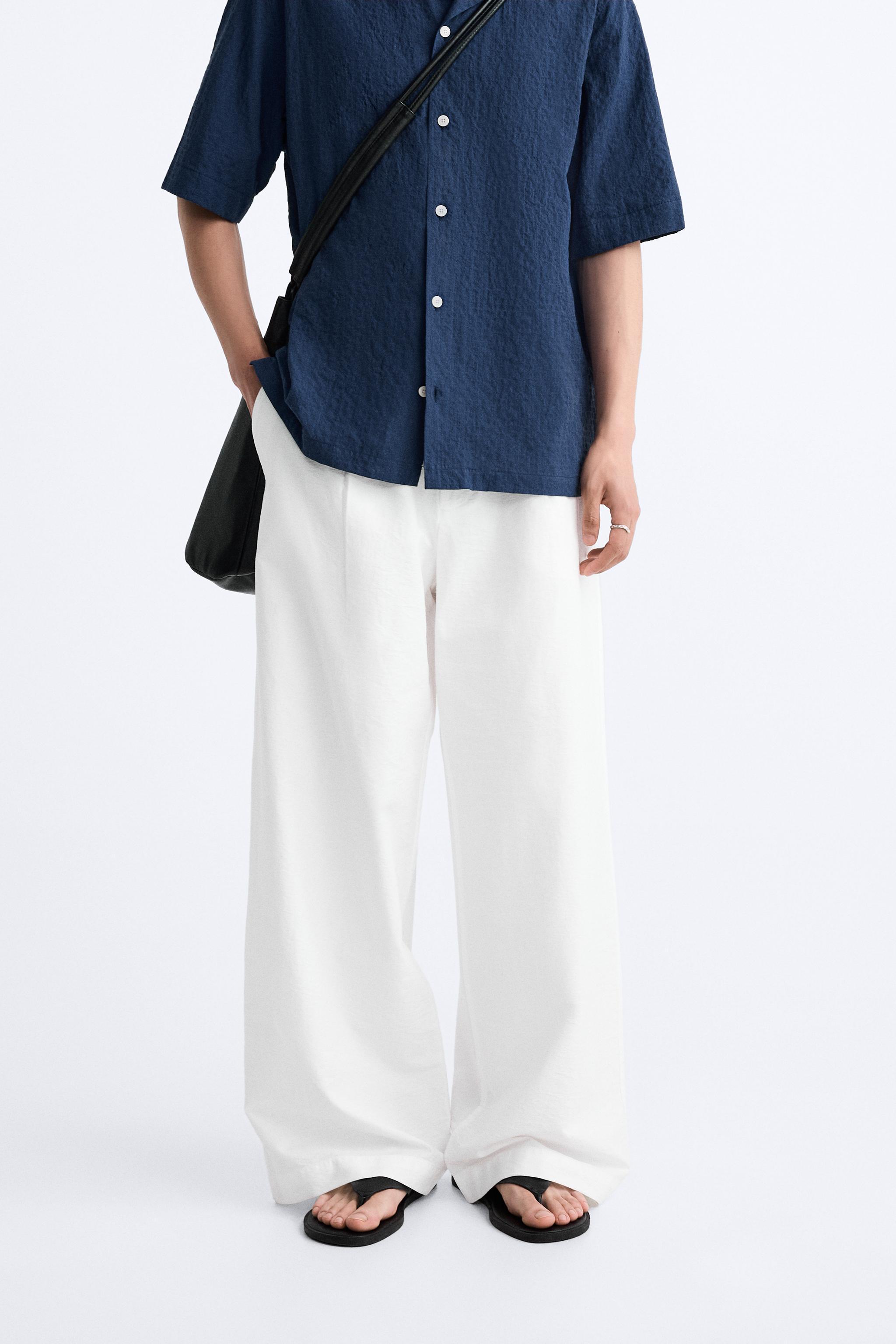 PLEATED WIDE FIT PANTS Product Image