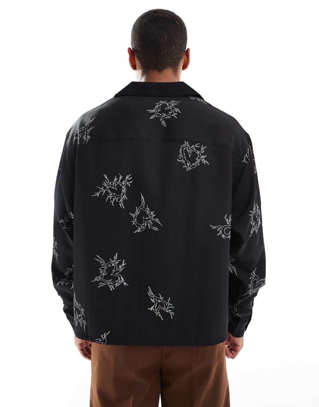 ASOS DESIGN boxy oversized deep revere shirt with heart print in black Product Image