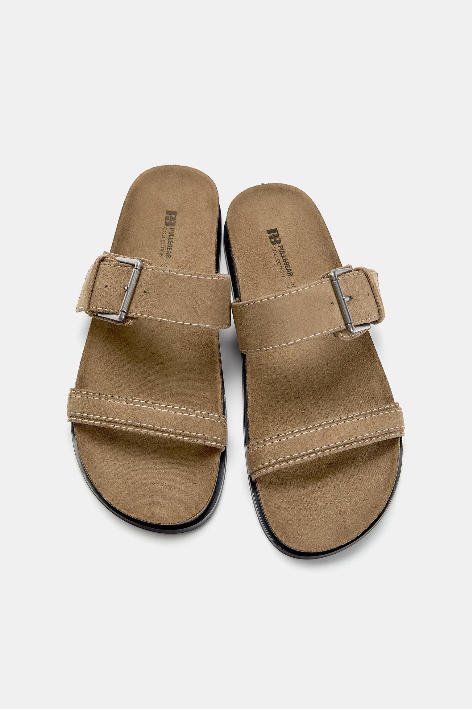 Flat sandals with buckles Product Image