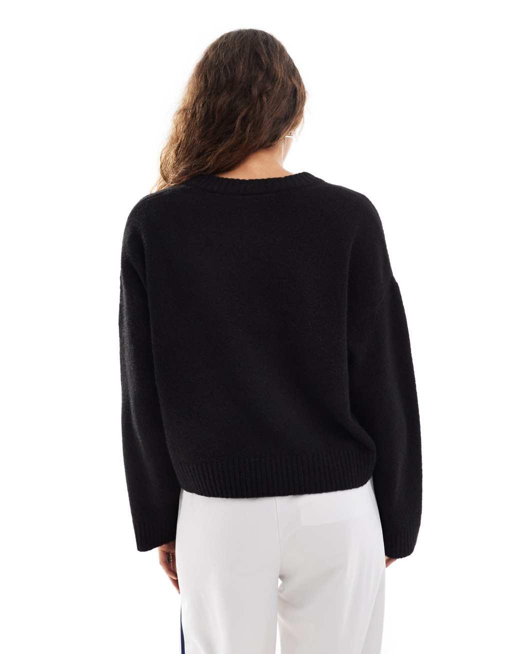 Monki round neck relaxed knit sweater in black Product Image