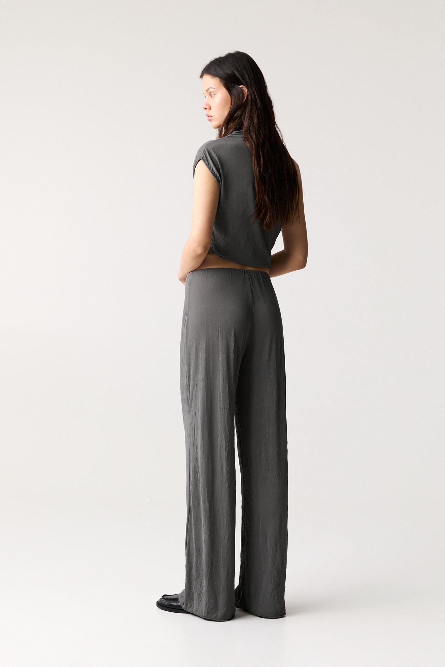 Creased-effect flared pants Product Image
