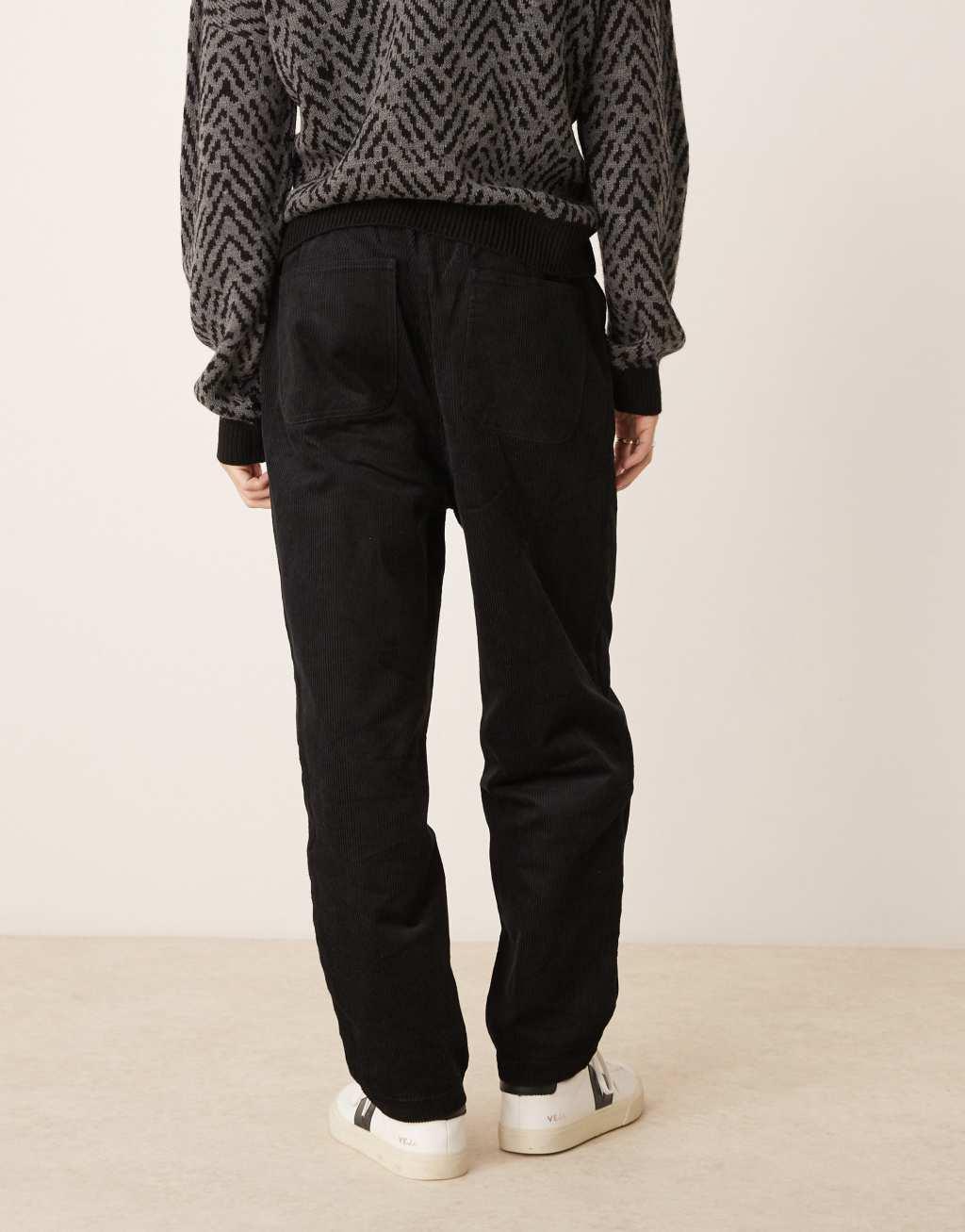 ASOS DESIGN tapered pull on cord sweatpants in black   Product Image