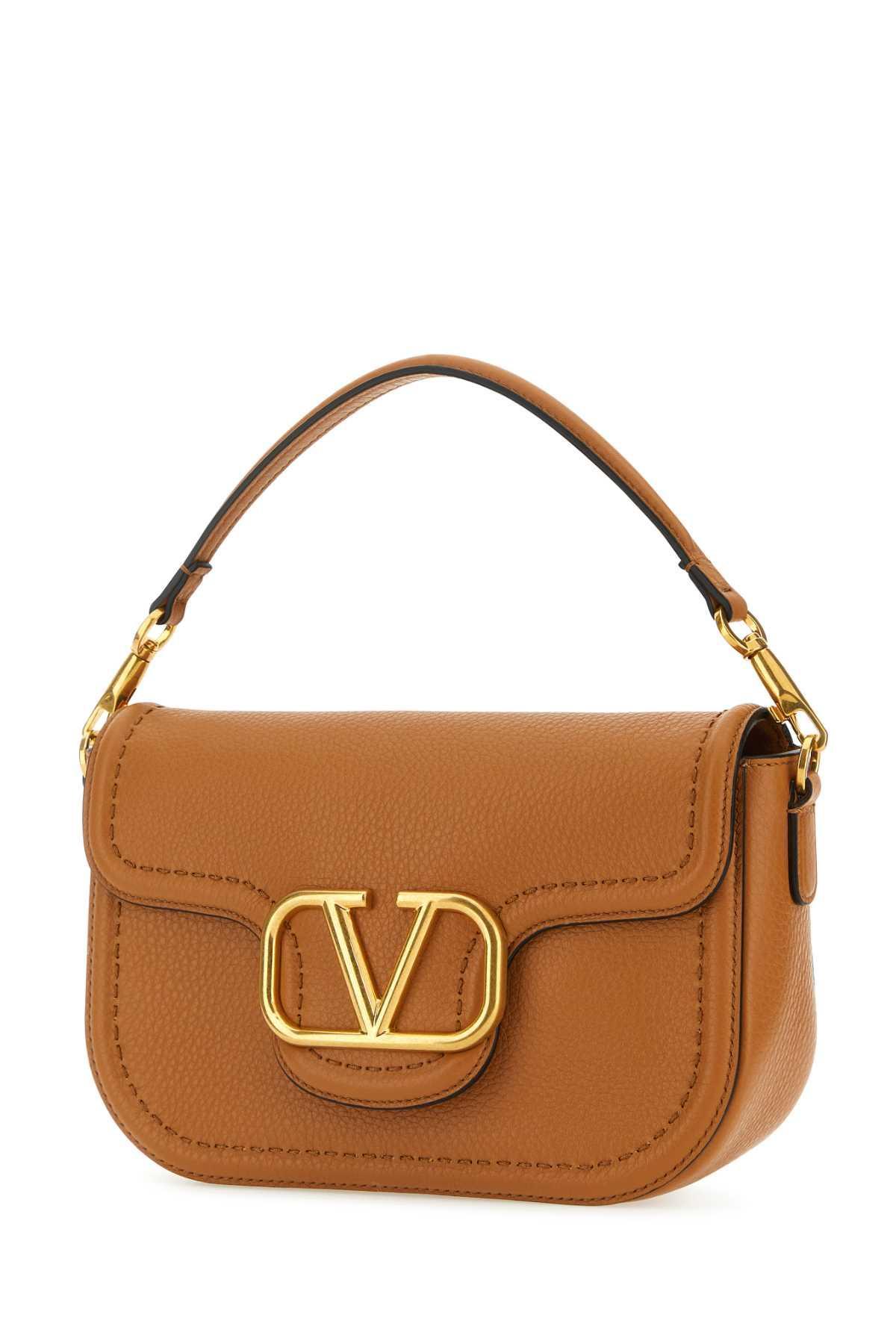 VALENTINO GARAVANI Hand Bags In Brown Product Image