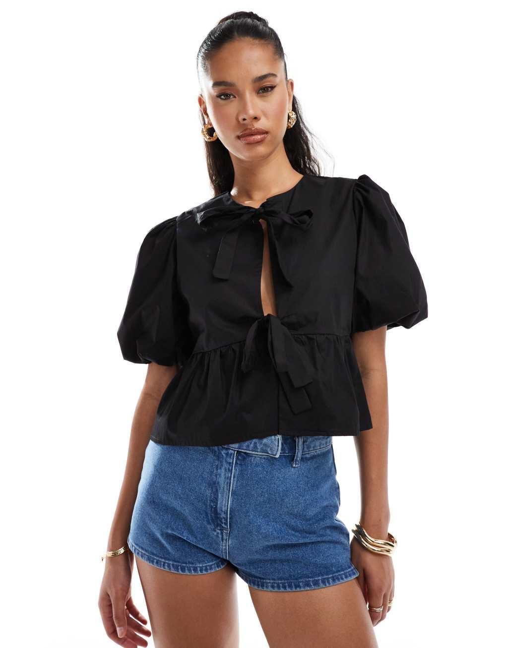 Kaiia puff sleeve tie front top in black Product Image