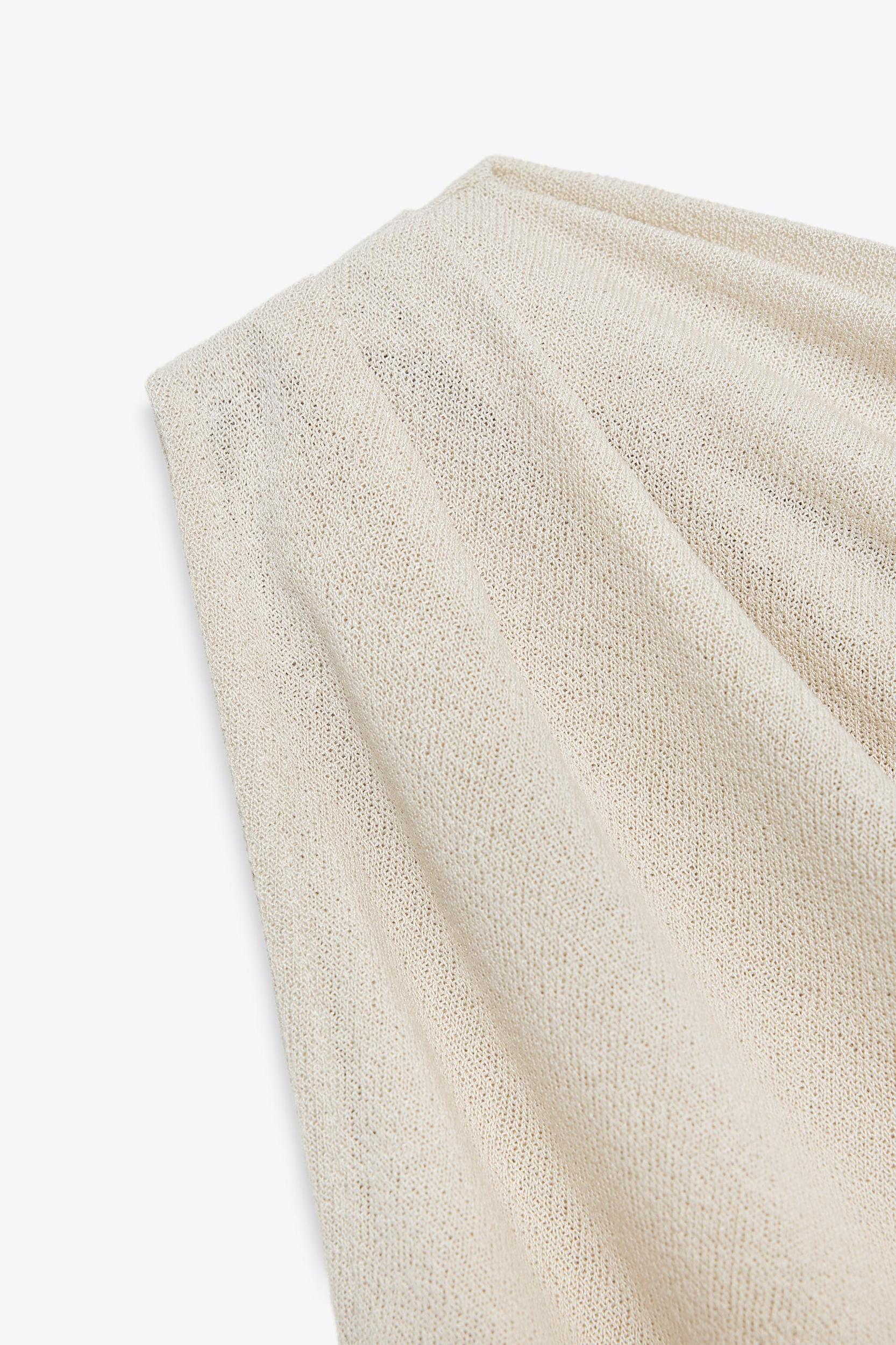 ASYMMETRIC CUT-OUT KNIT TOP Product Image