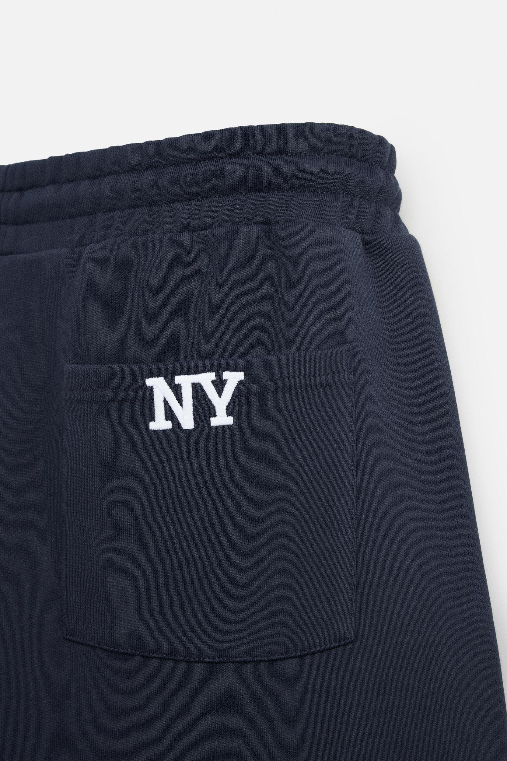 EMBROIDERED OVERSIZED FIT JOGGER SHORTS Product Image