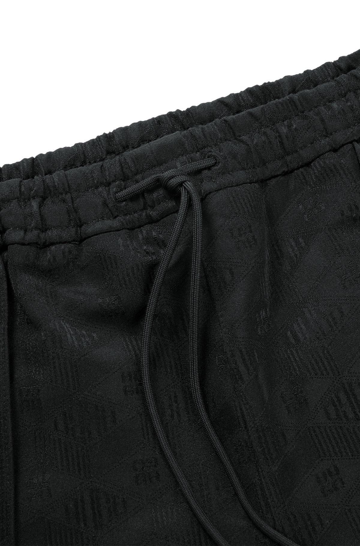 Relaxed-fit shorts with geometric logos Product Image