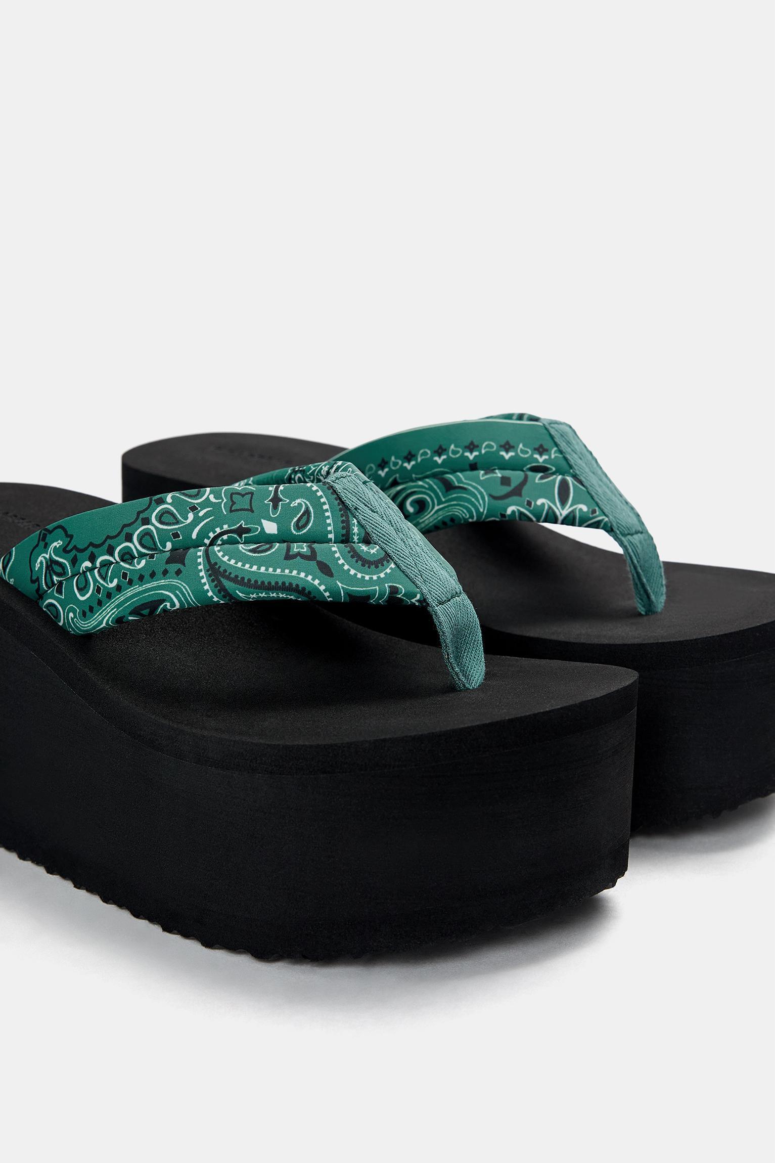 Wedge sandals with detail Product Image