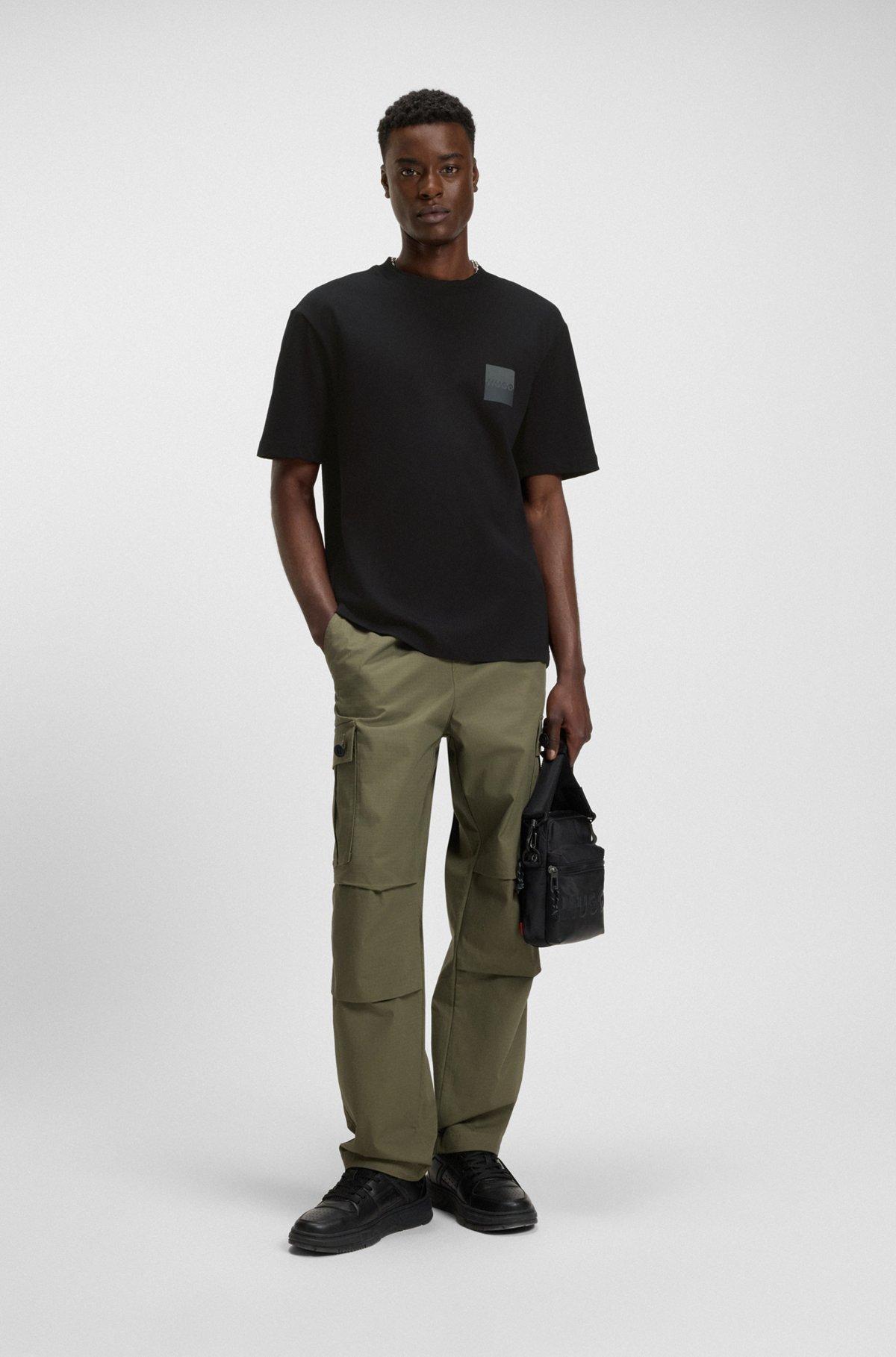 HUGO - Relaxed-fit T-shirt in cotton with split logos - Black Product Image