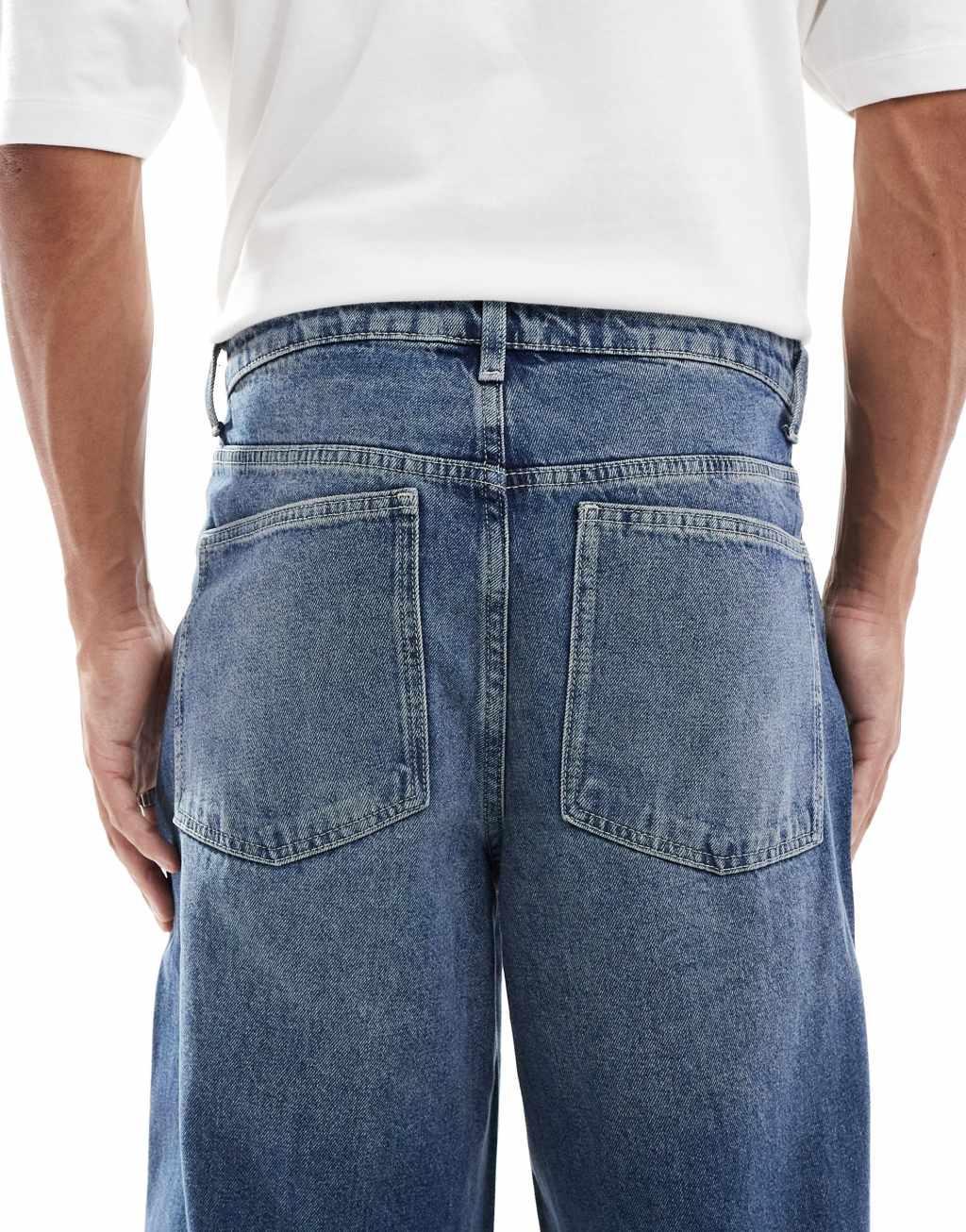 ASOS DESIGN super baggy jeans in mid wash blue Product Image