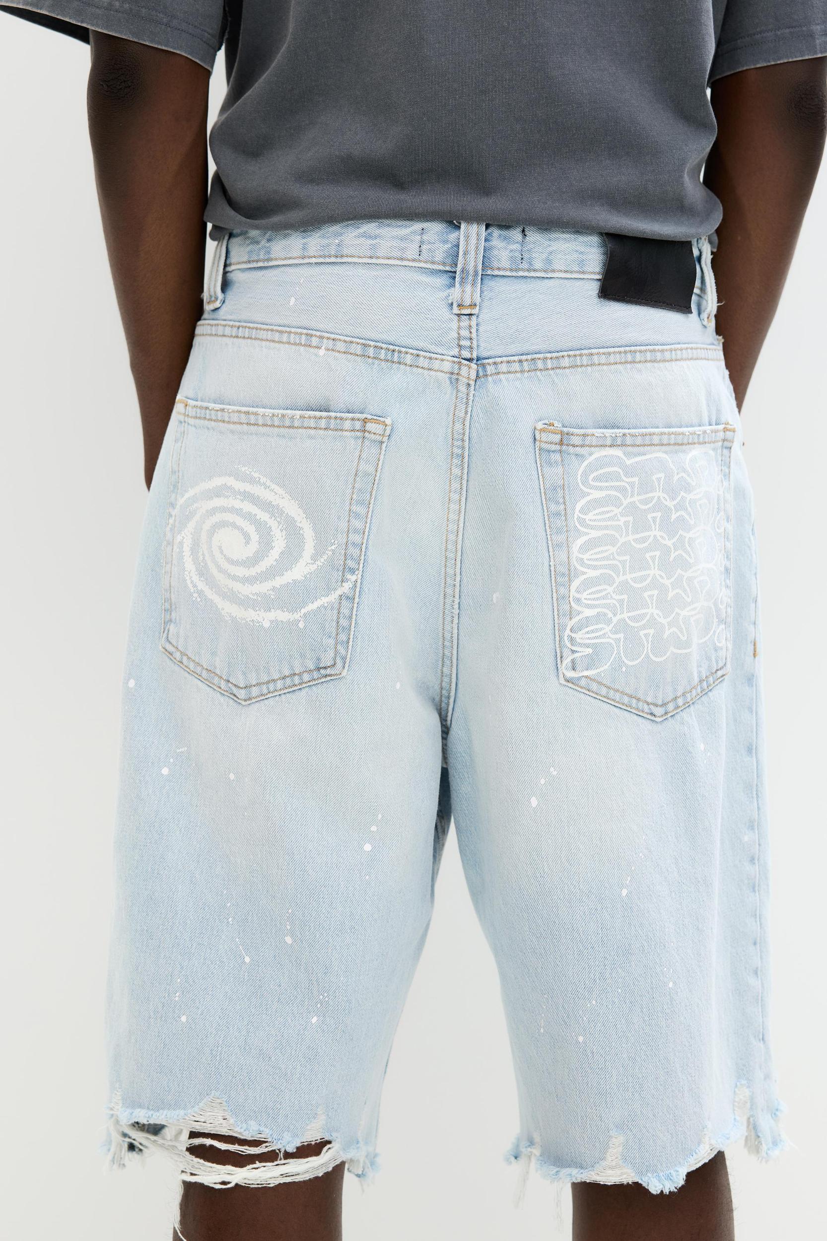 Ripped denim Bermuda shorts Product Image