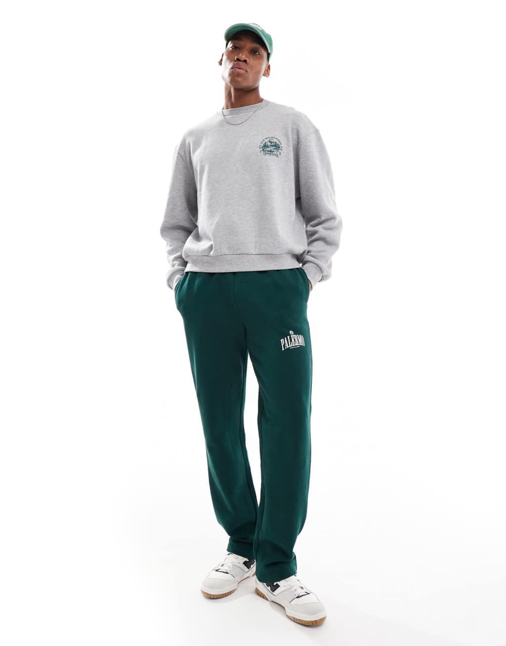 ASOS DESIGN straight leg sweatpants with Palermo print in green Product Image