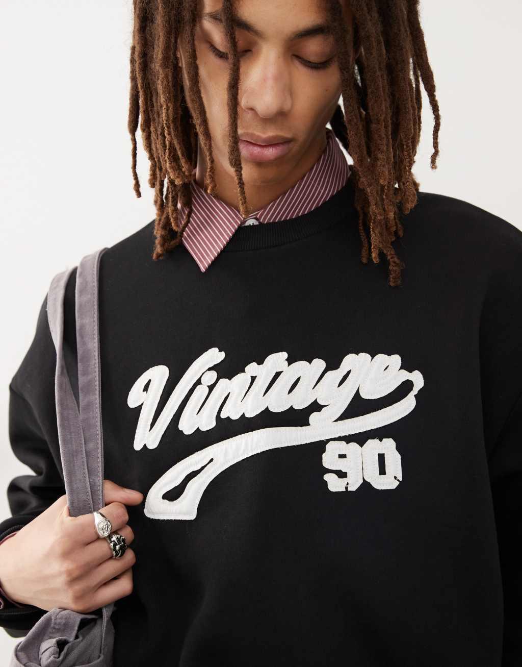 Reclaimed Vintage cropped boxy sweat with applique varsity logo in washed black Product Image