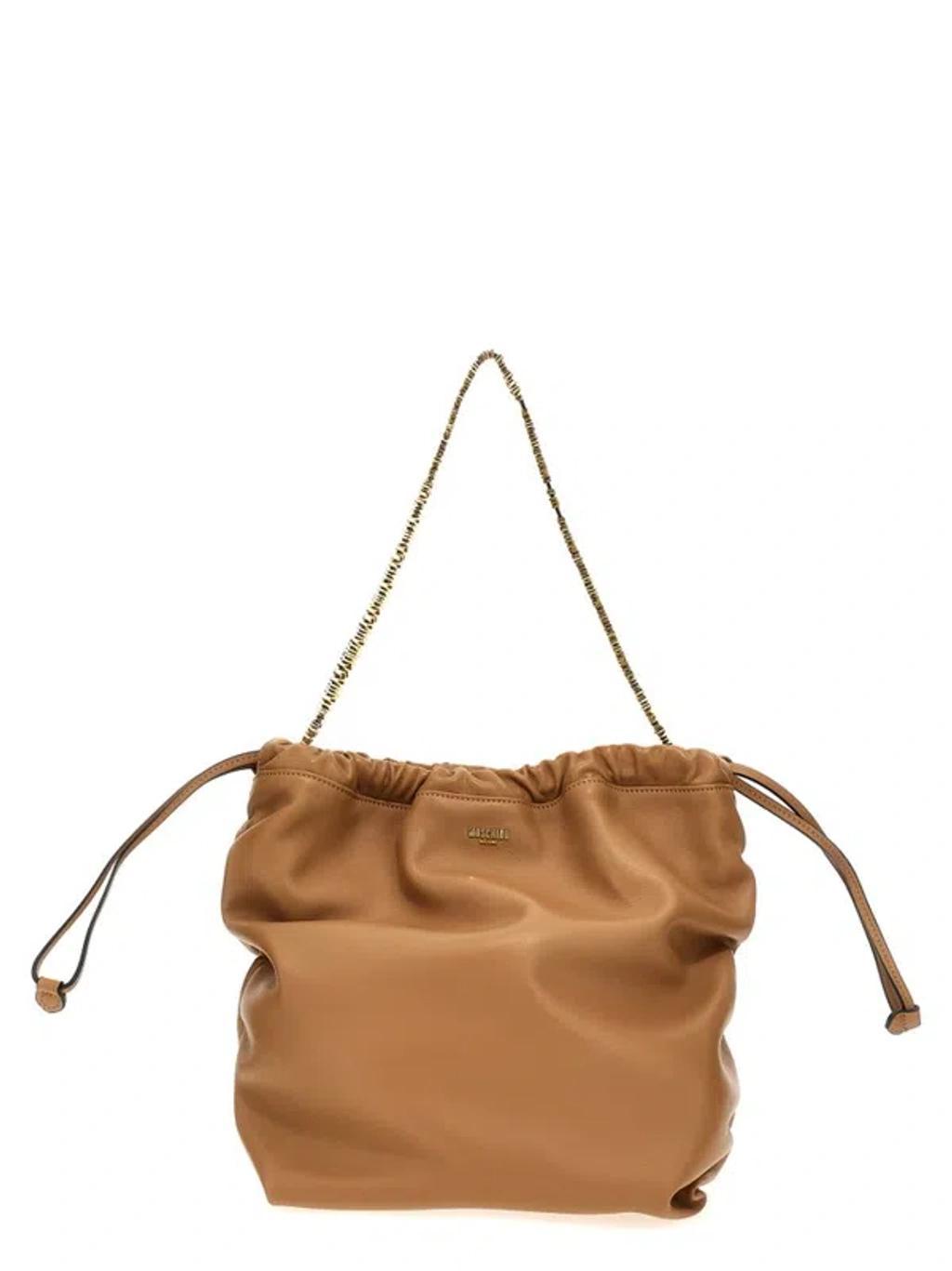 MOSCHINO Logo Plaque Drawstring Shoulder Bag In Brown Product Image