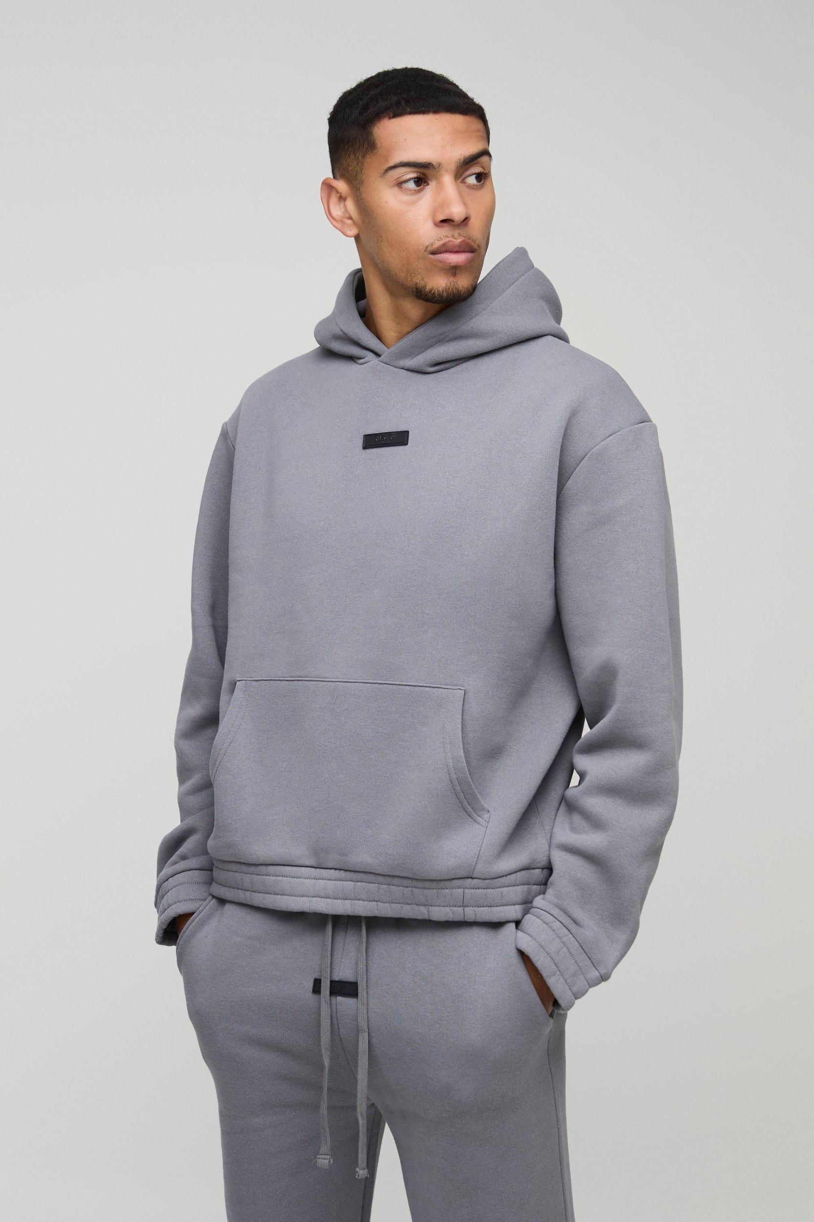 Oversized Boxy Flare Stacked Hooded Tracksuit With Rubber Badge | boohooMAN USA Product Image