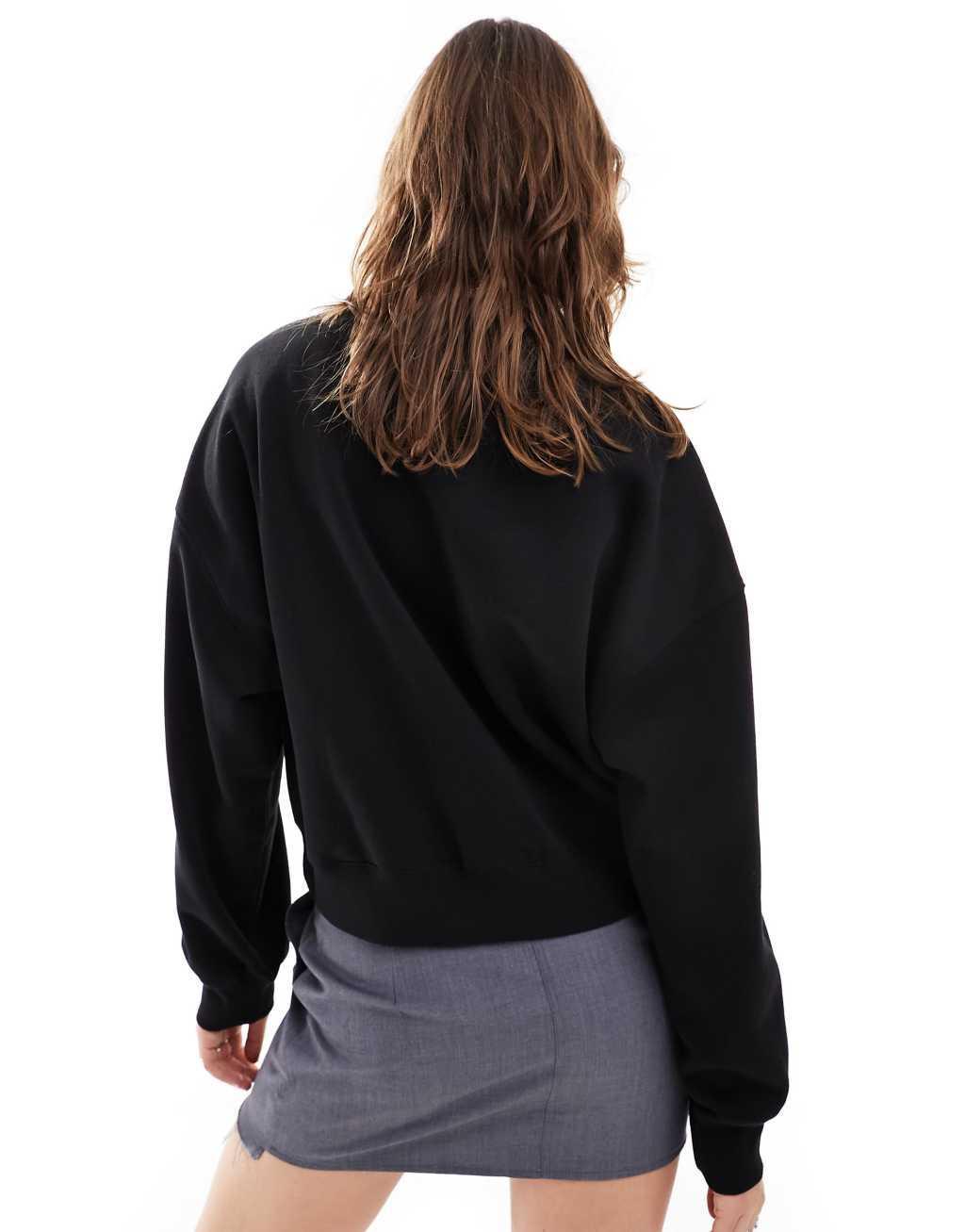 Monki round neck long sleeve sweatshirt in black Product Image