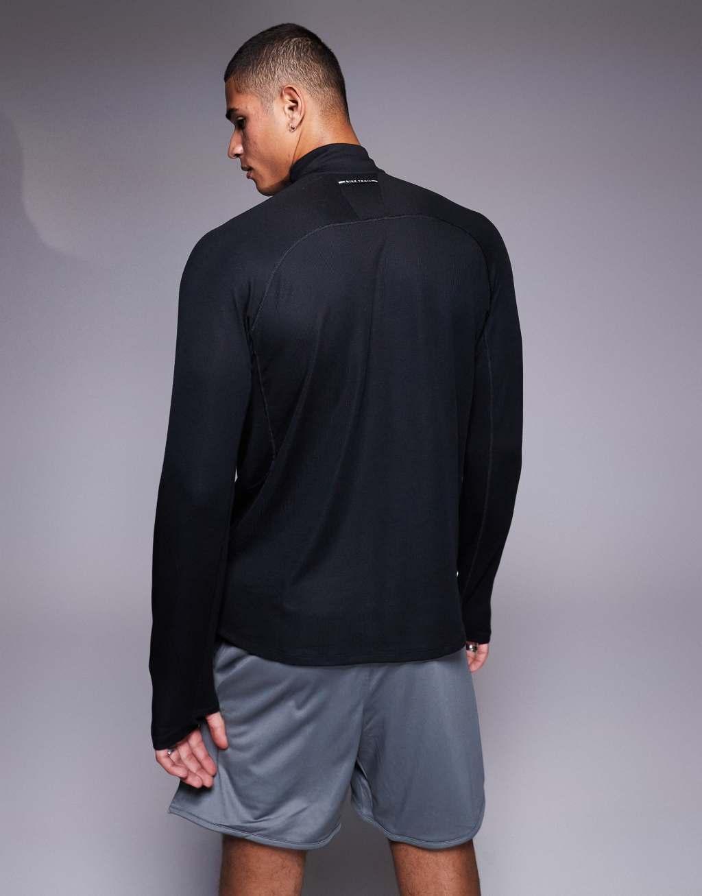 Nike Running Trail logo half zip sweatshirt in black Product Image