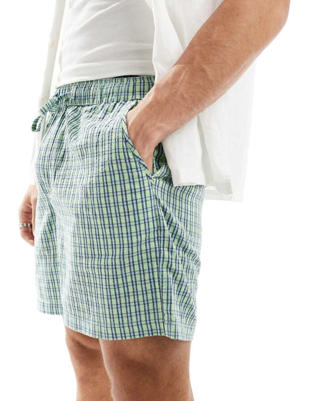 ASOS DESIGN textured shorts in check in green Product Image