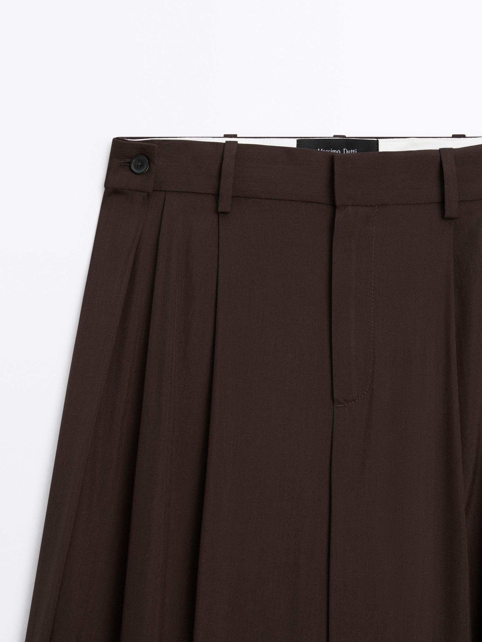 Flowing trousers with darts Product Image