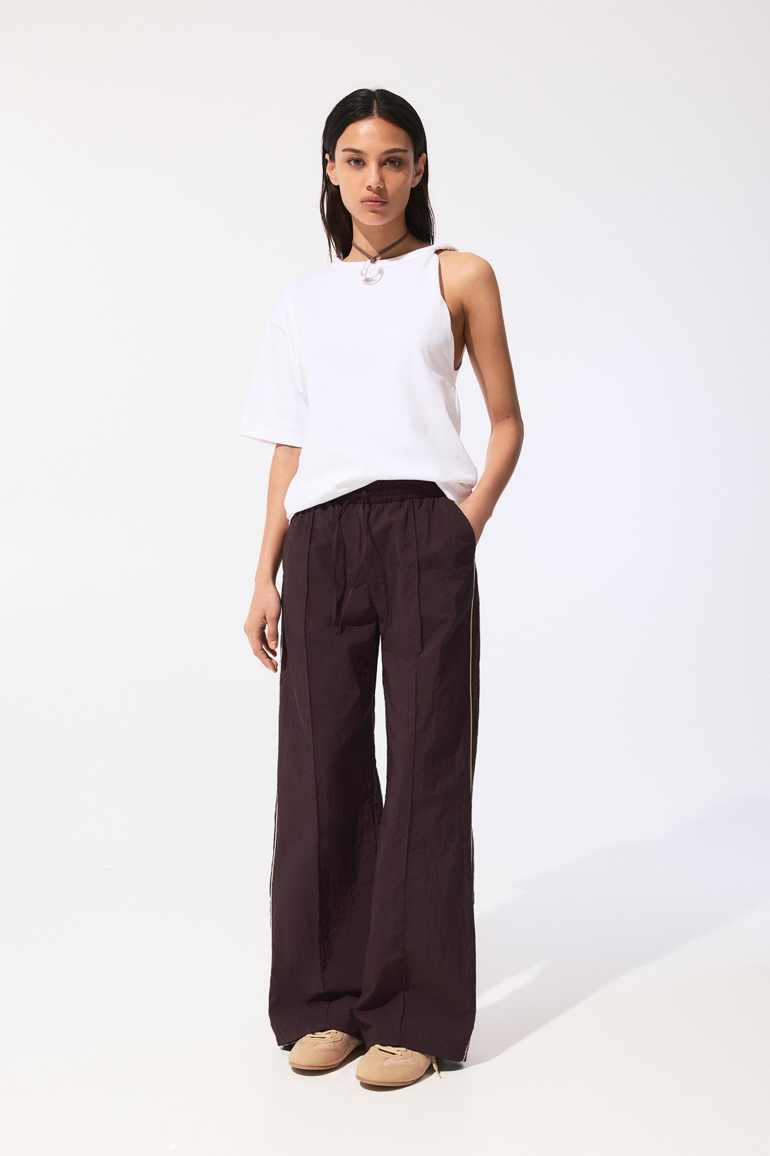 Tracksuit pants with side stripes Product Image