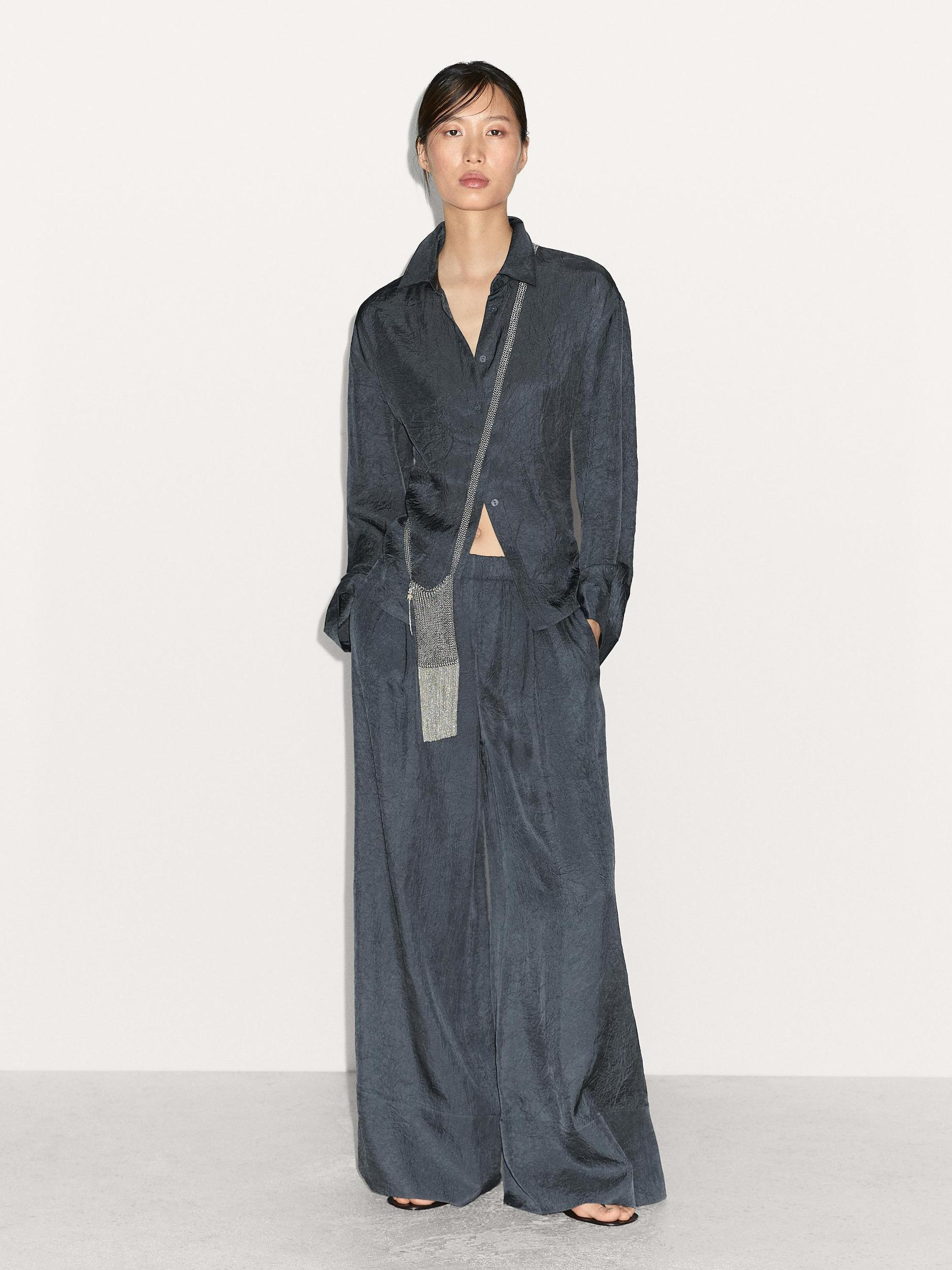 Flowing creased-effect trousers Product Image