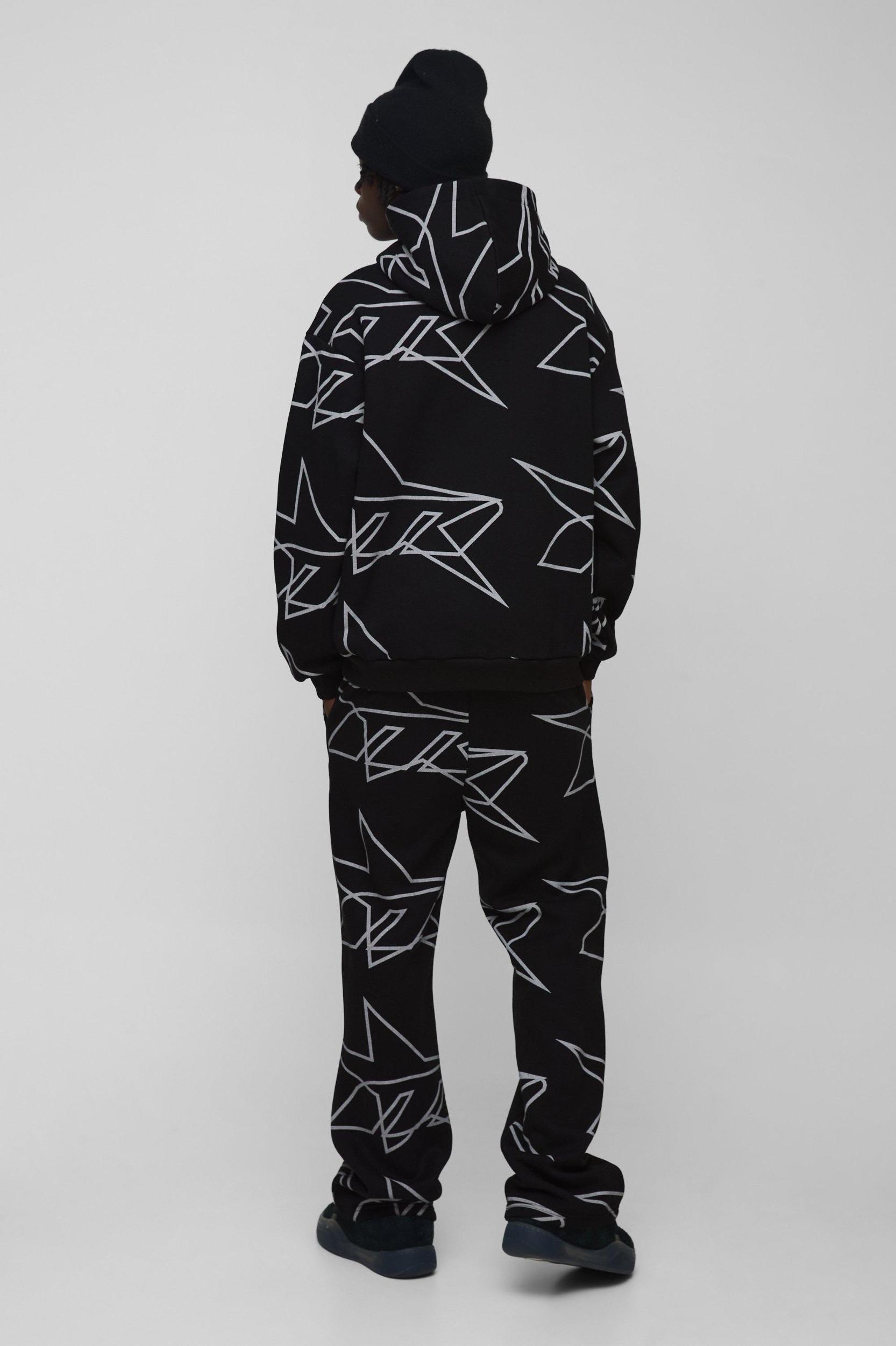 Oversized Star All Over Printed Gusset Flare Hooded Tracksuit | boohooMAN USA Product Image