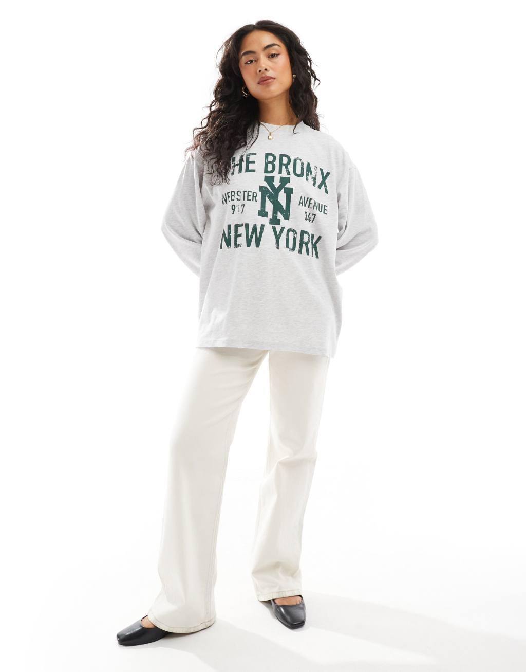 ASOS DESIGN long sleeve skater T-shirt with bronx graphic in ice heather Product Image