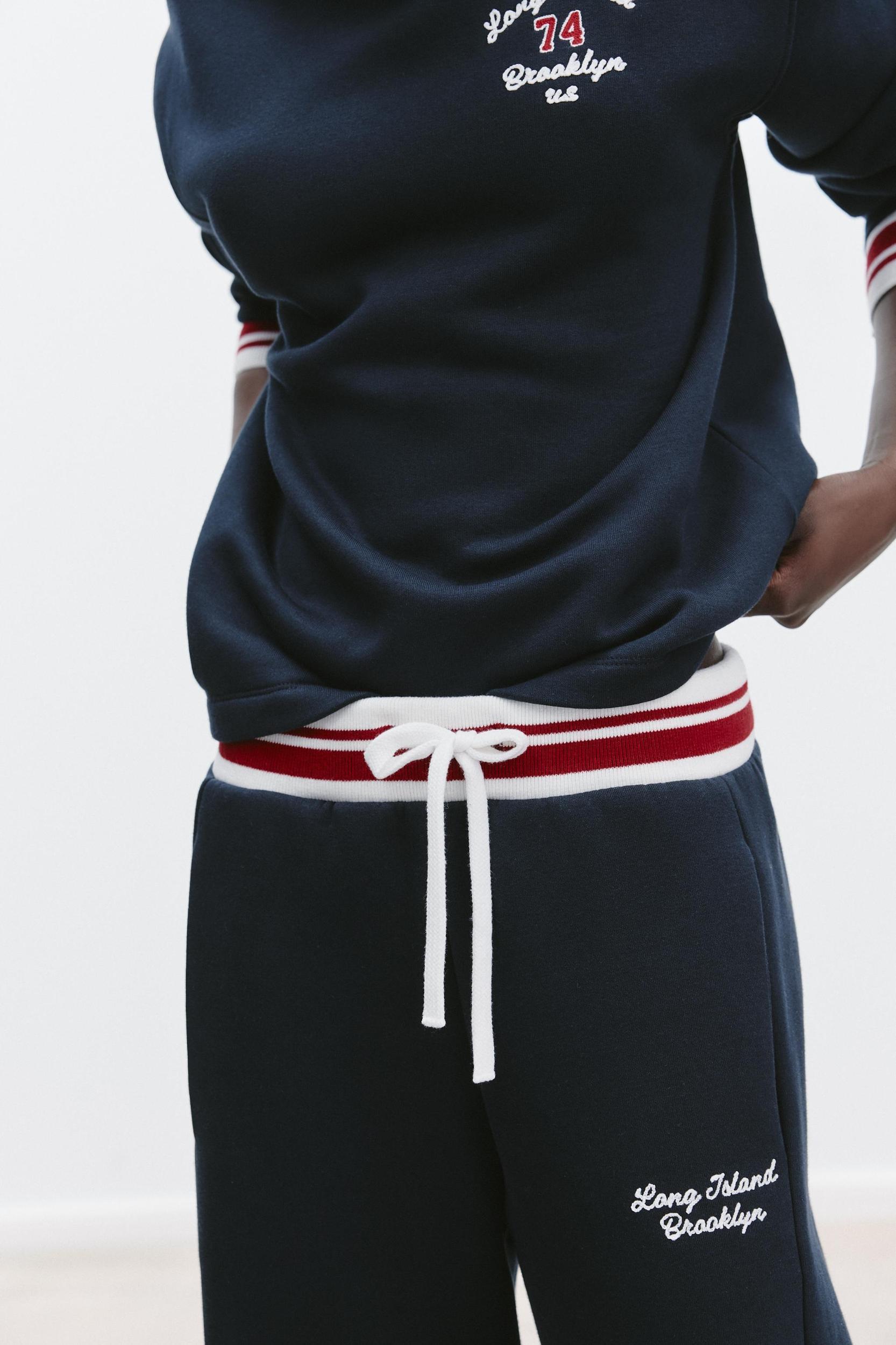 EMBROIDERED TEXT PANTS Product Image