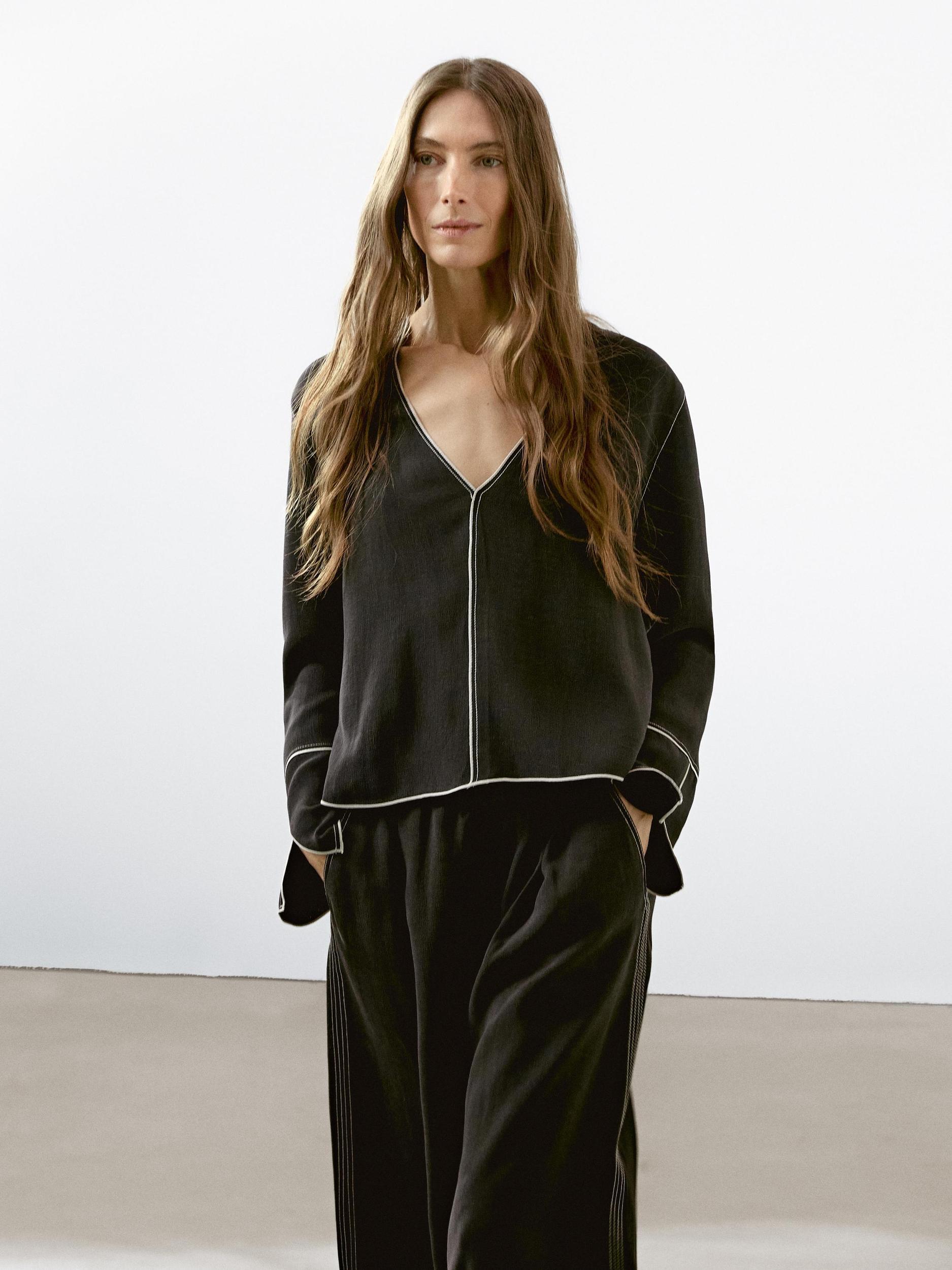 Flowing trousers with contrast topstitching Product Image