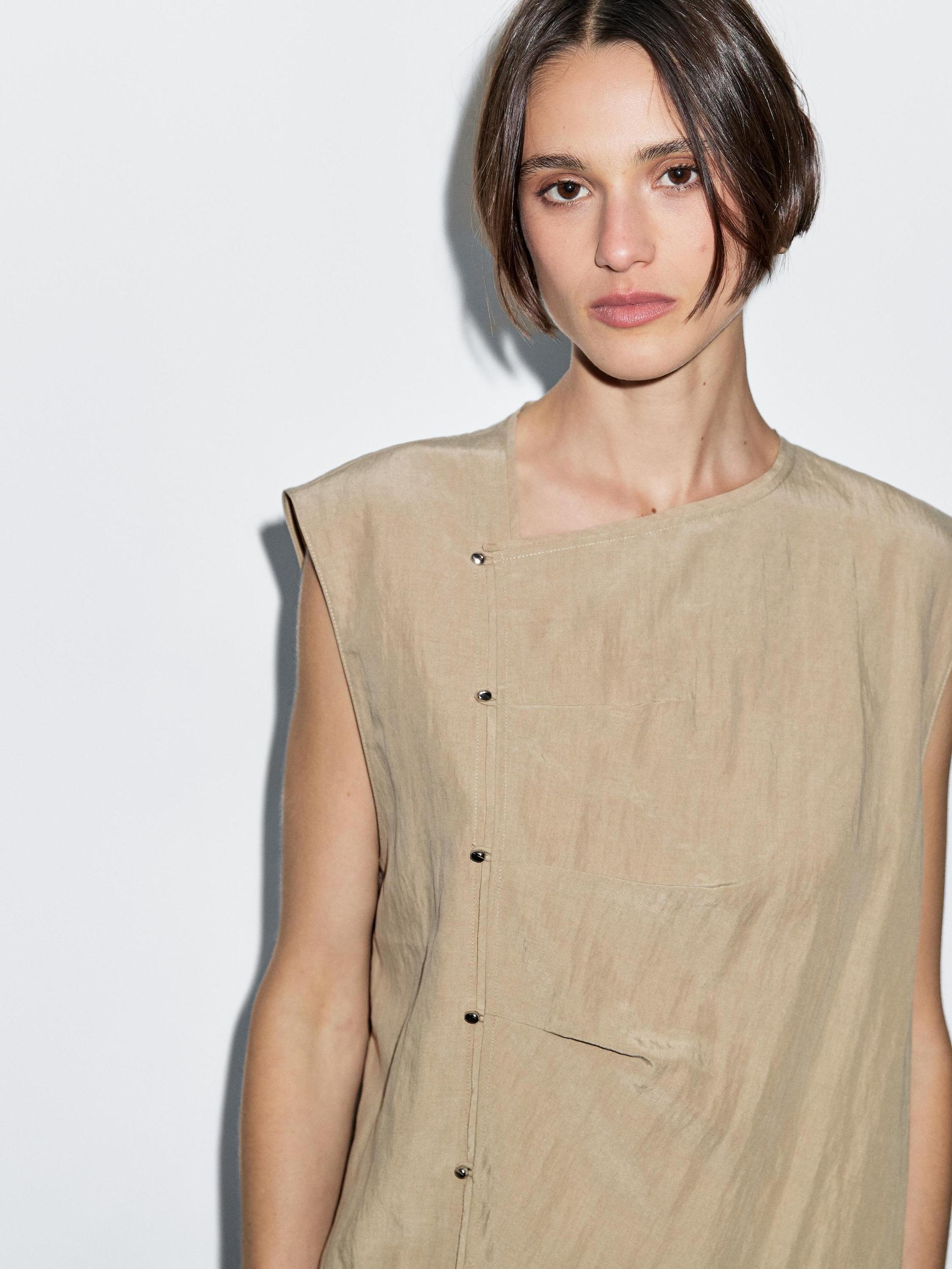 Blouse with silver button fastening on the side Product Image