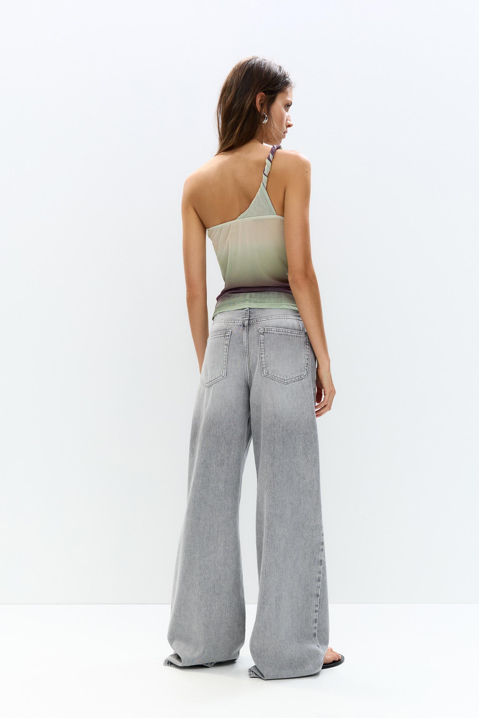 Asymmetric tulle top with a knotted strap Product Image