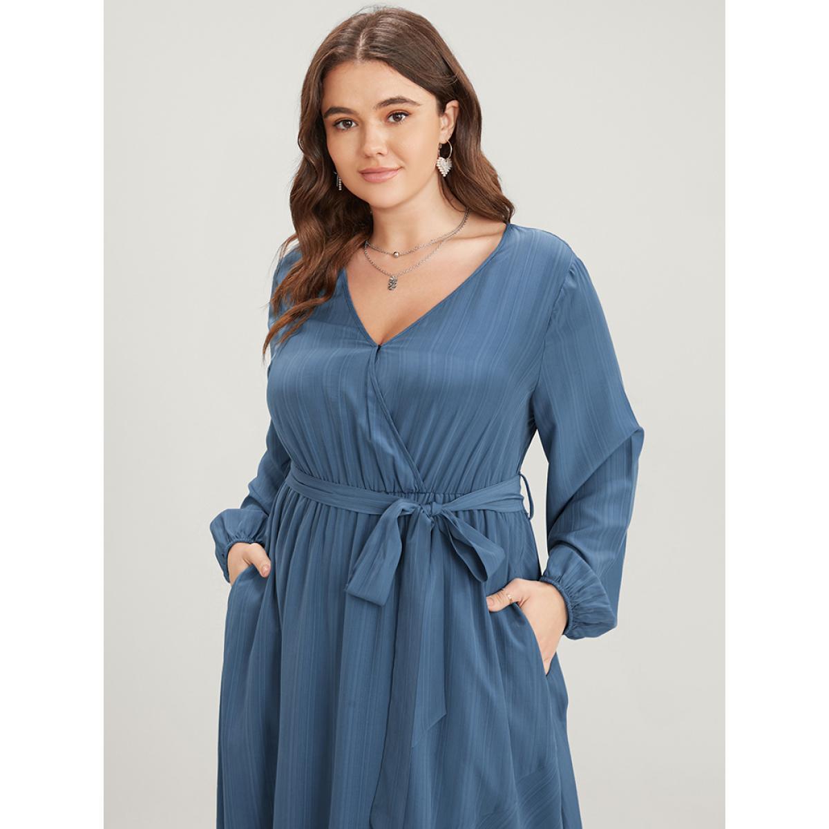 Plus Size Solid Surplice Neck Lantern Sleeve Pocket Belted Asymmetrical Hem Dress Cerulean Women Elegant Asymmetrical V-neck Long Sleeve Curvy Midi Dress BloomChic 30/6X Product Image