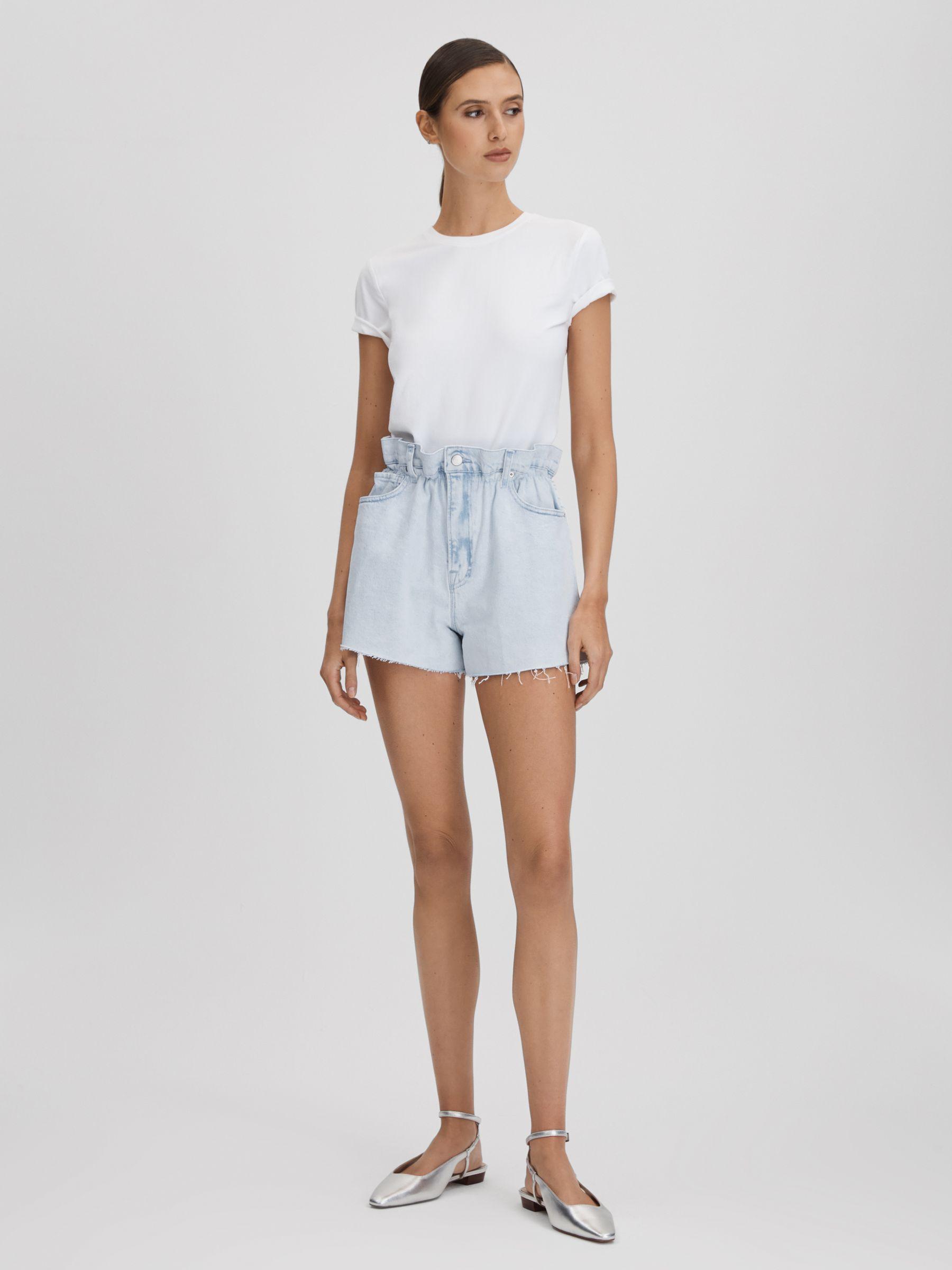 Good American Elasticated Waist Distressed Denim Shorts in Light Blue Product Image