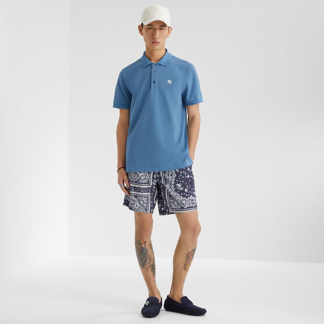 Polo shirtLight blue piqué polo shirt Product Image