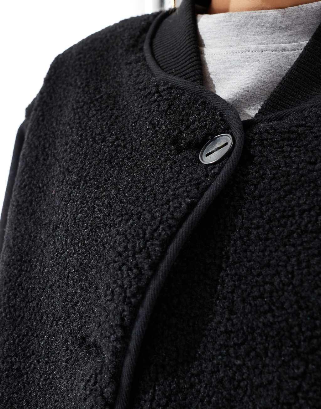 ASOS DESIGN spliced teddy formal jacket in black Product Image