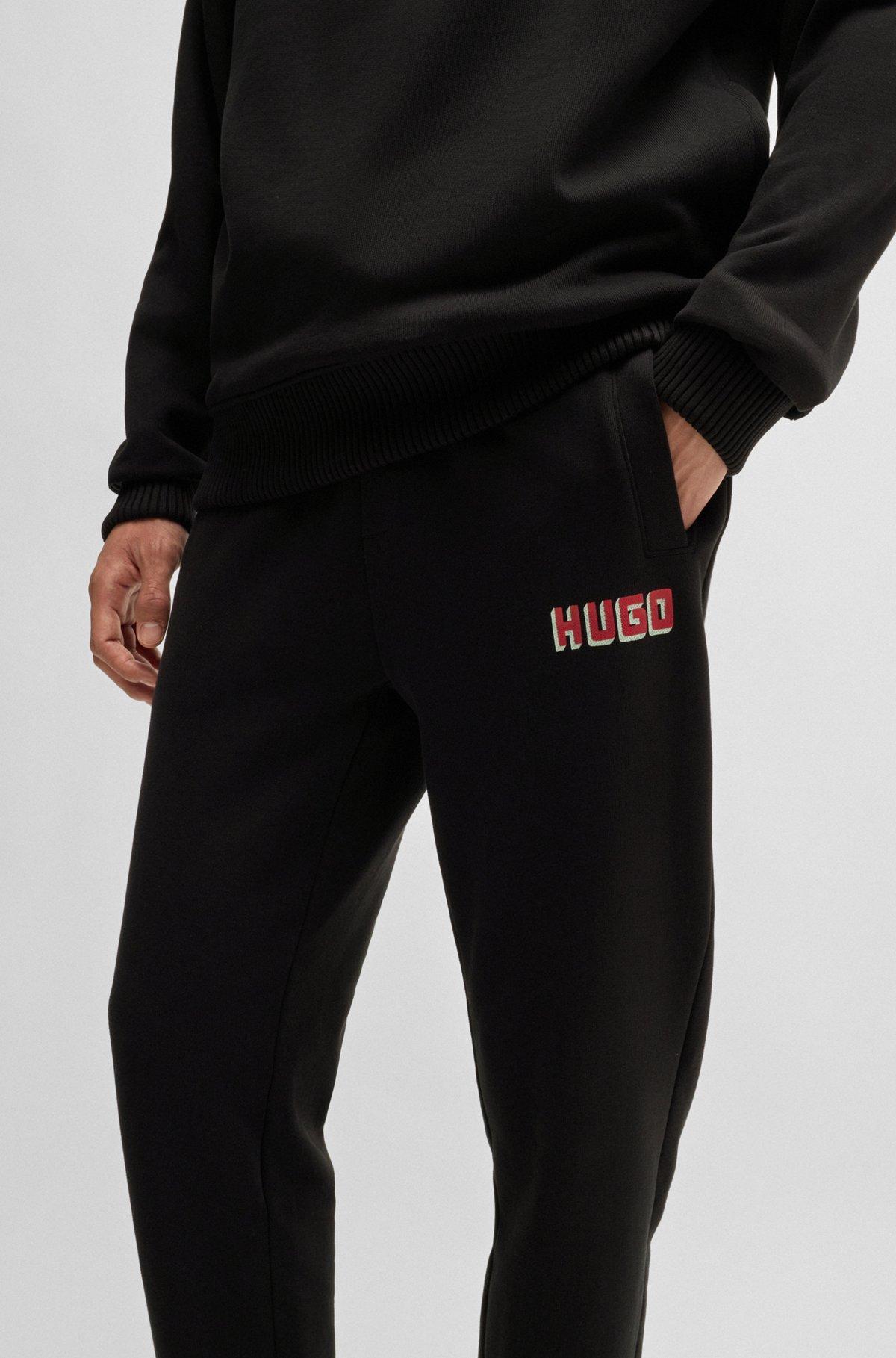 Cotton-terry tracksuit bottoms with logo print Product Image