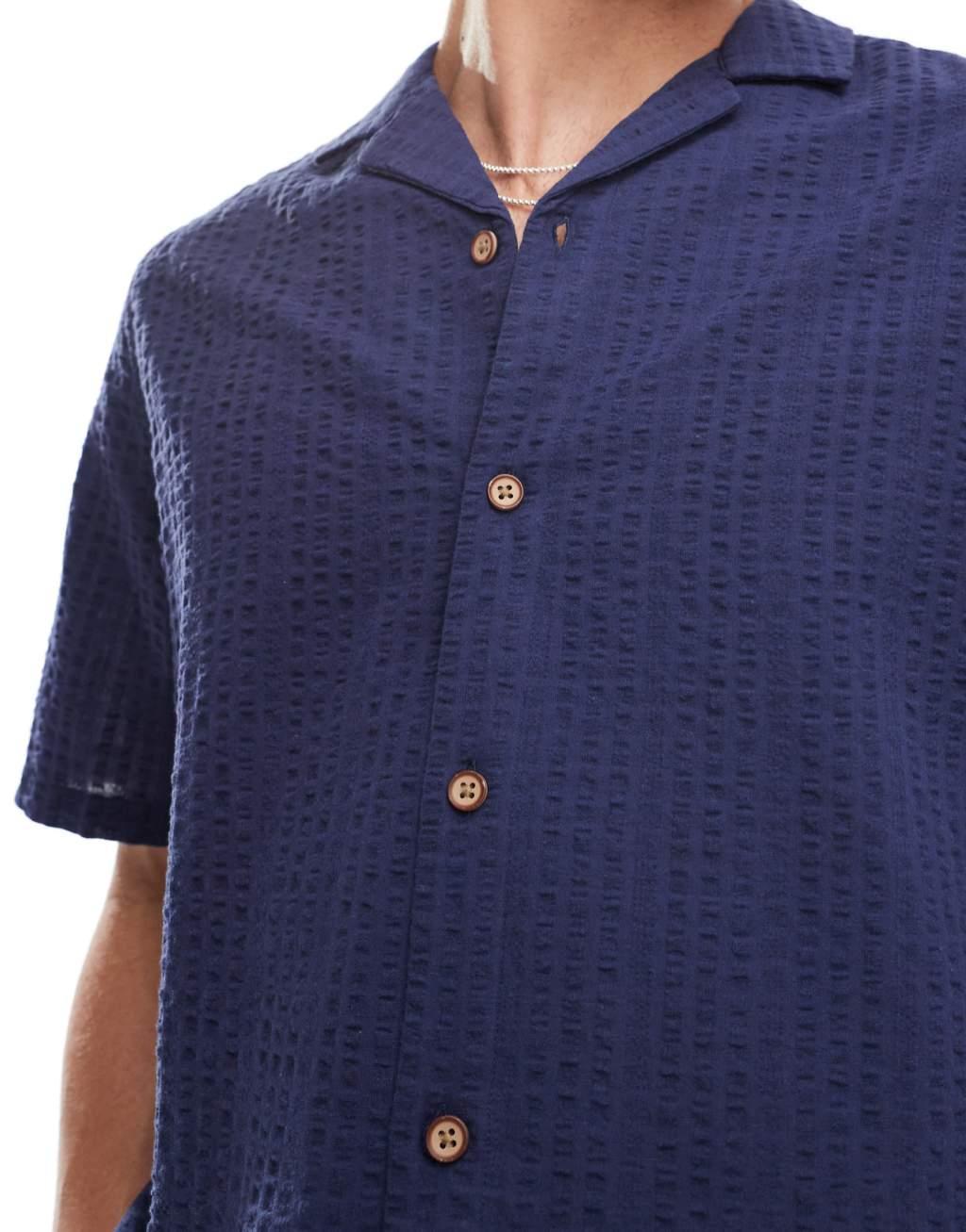 ASOS DESIGN 90s oversized short sleeve shirt in seersucker texture in navy - part of a set Product Image