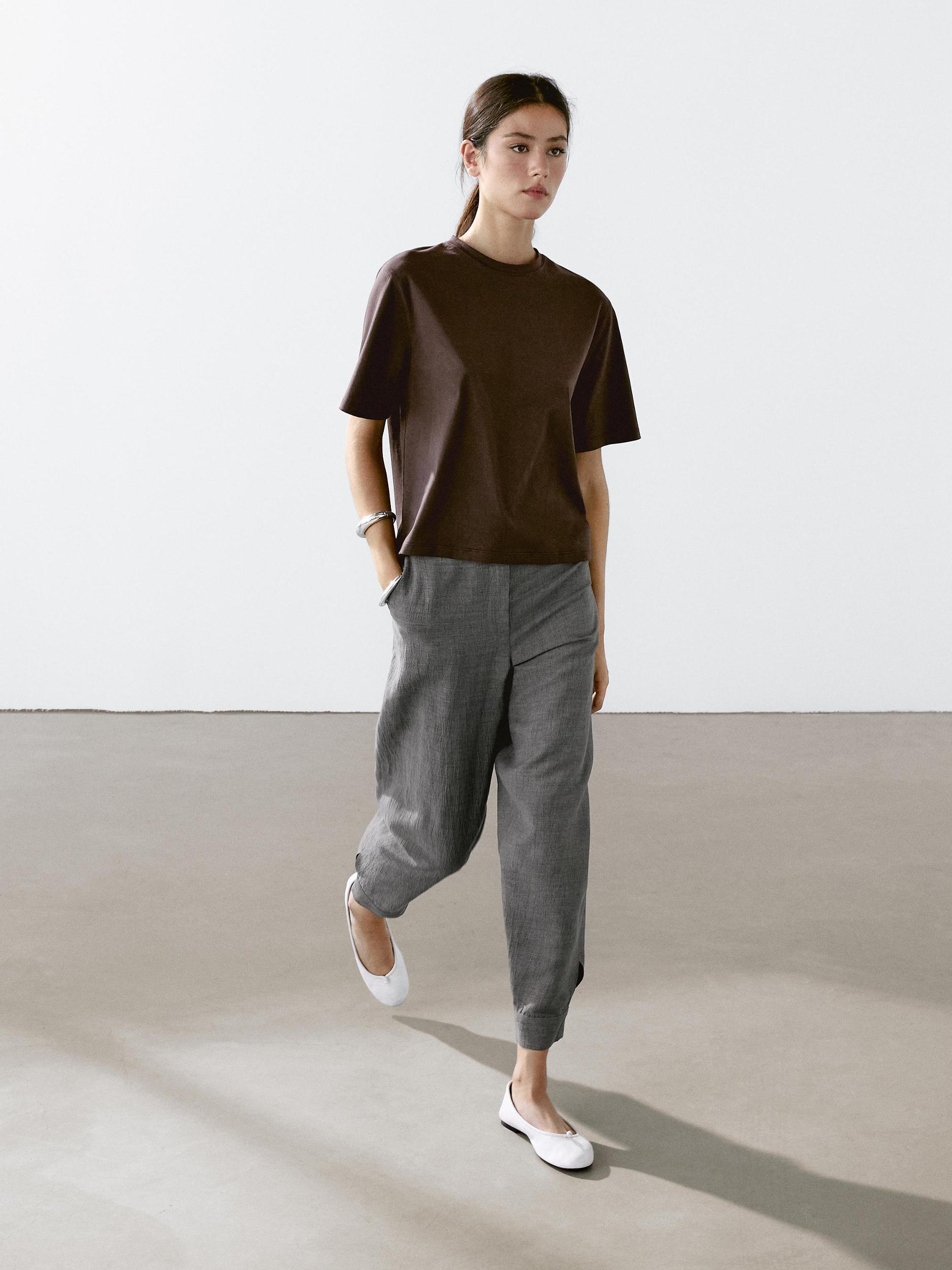 Balloon fit trousers with button details Product Image