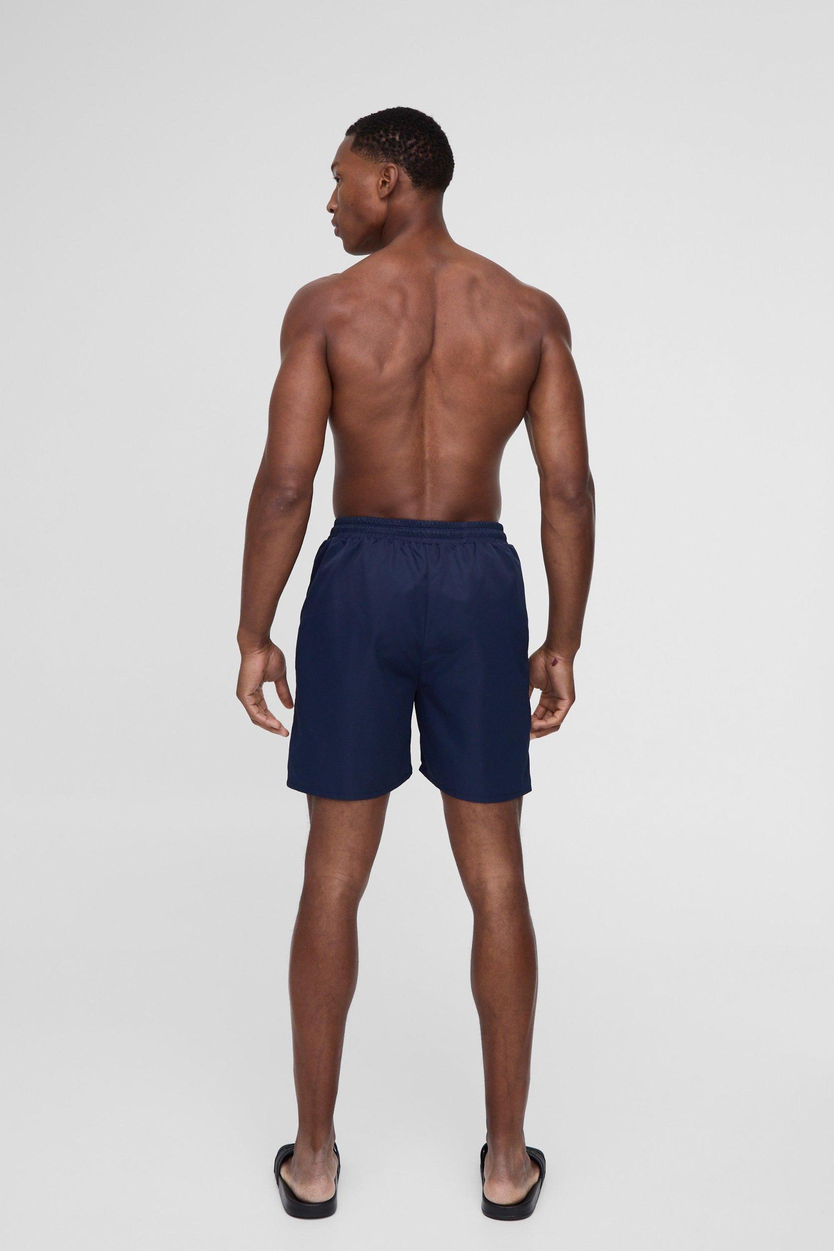 Mid Length Swim Trunks in Navy | boohooMAN USA Product Image